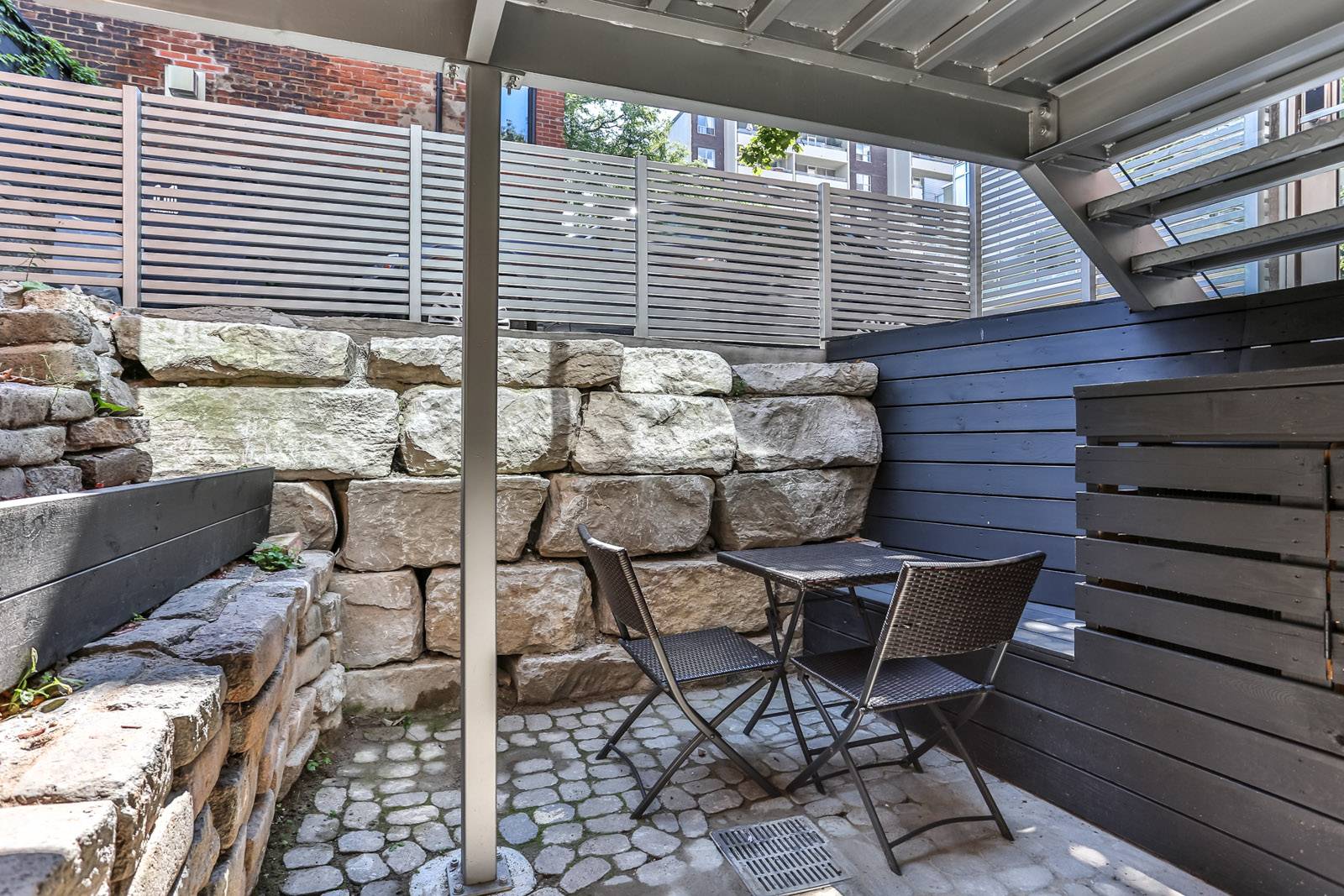 115 Maitland Street patio and brick wall.