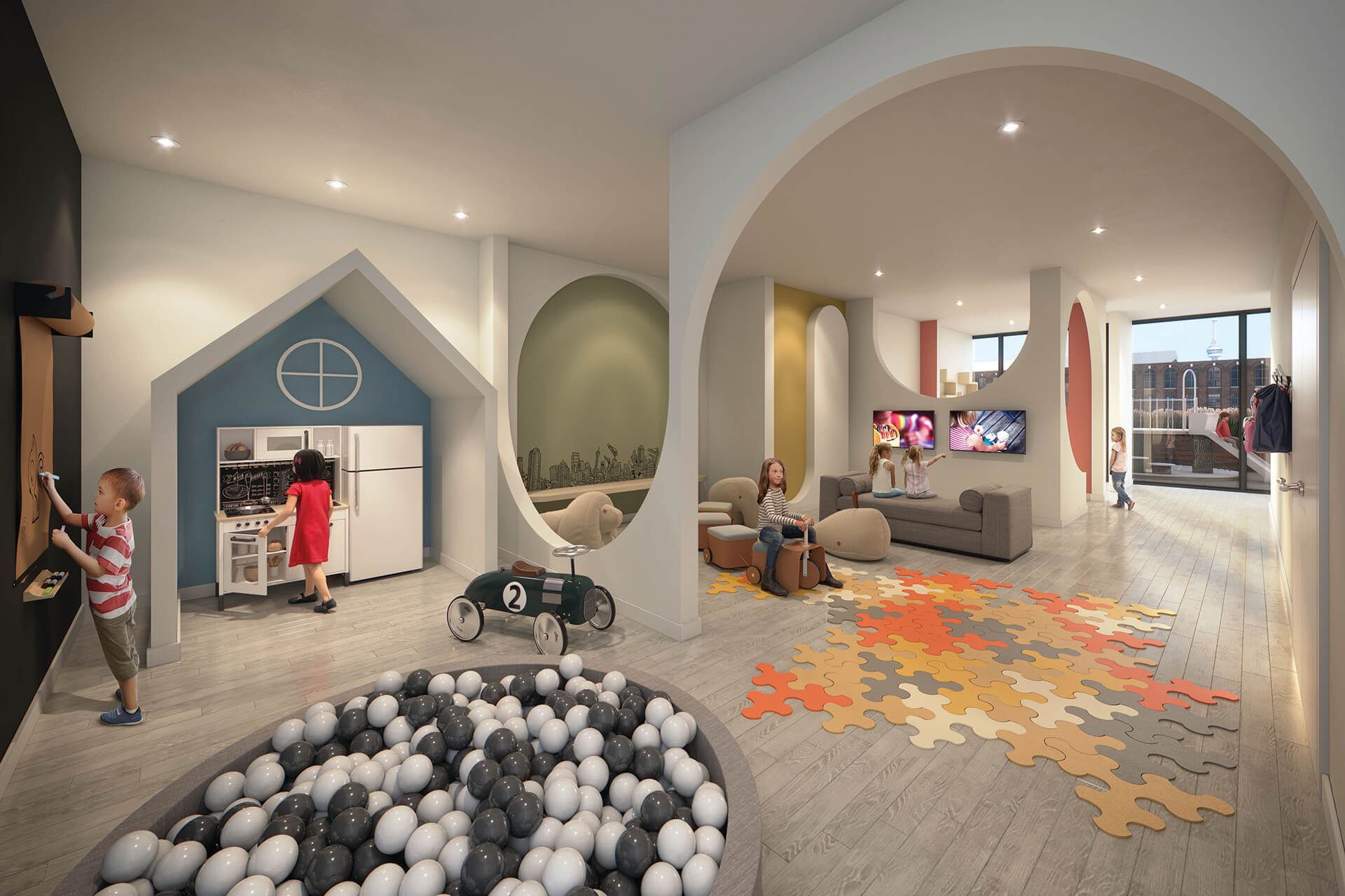 Kid's play room with ball pit and other areas at XO Condos.