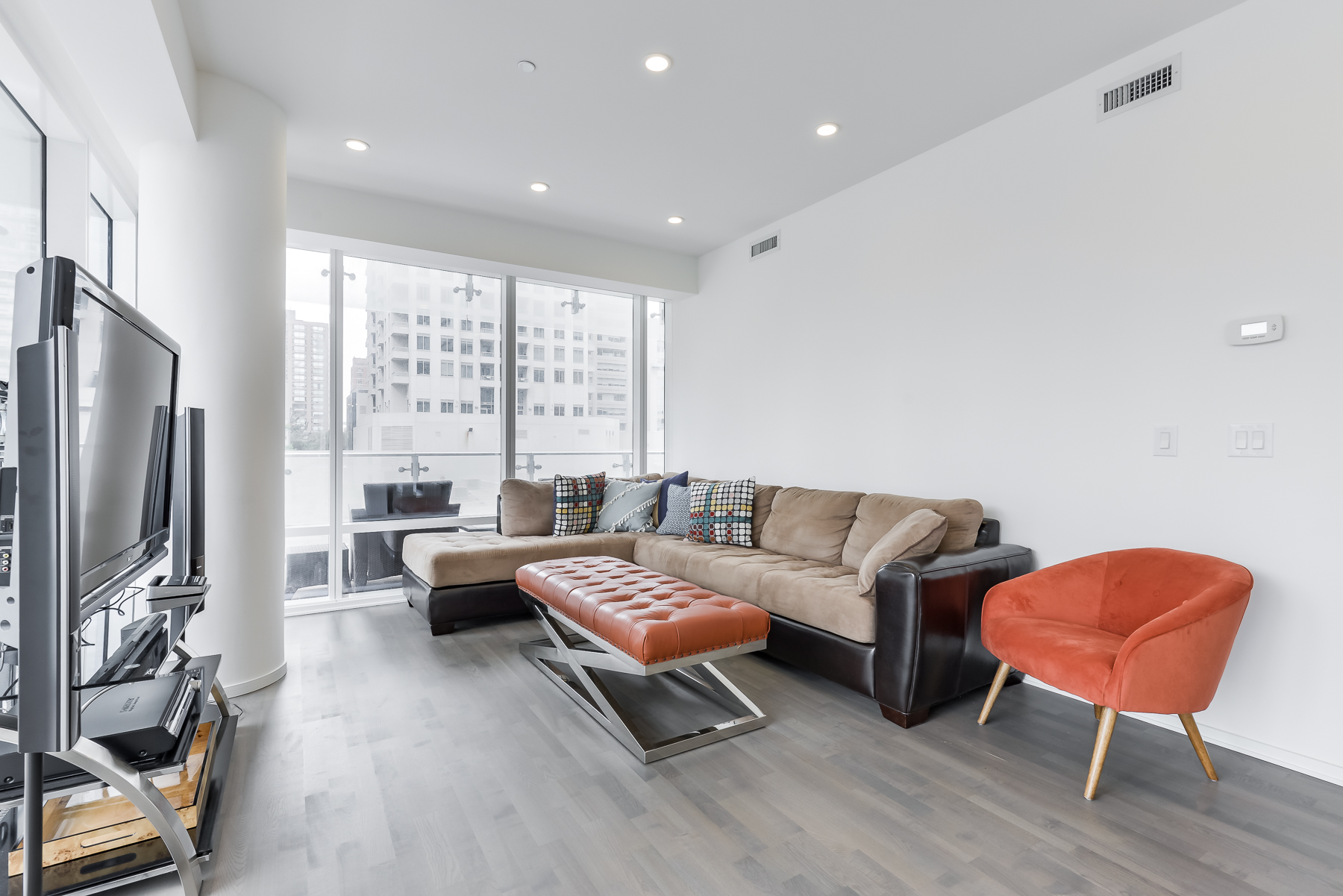 Fully furnished living room of 1 Bloor St E Unit 310 Toronto.