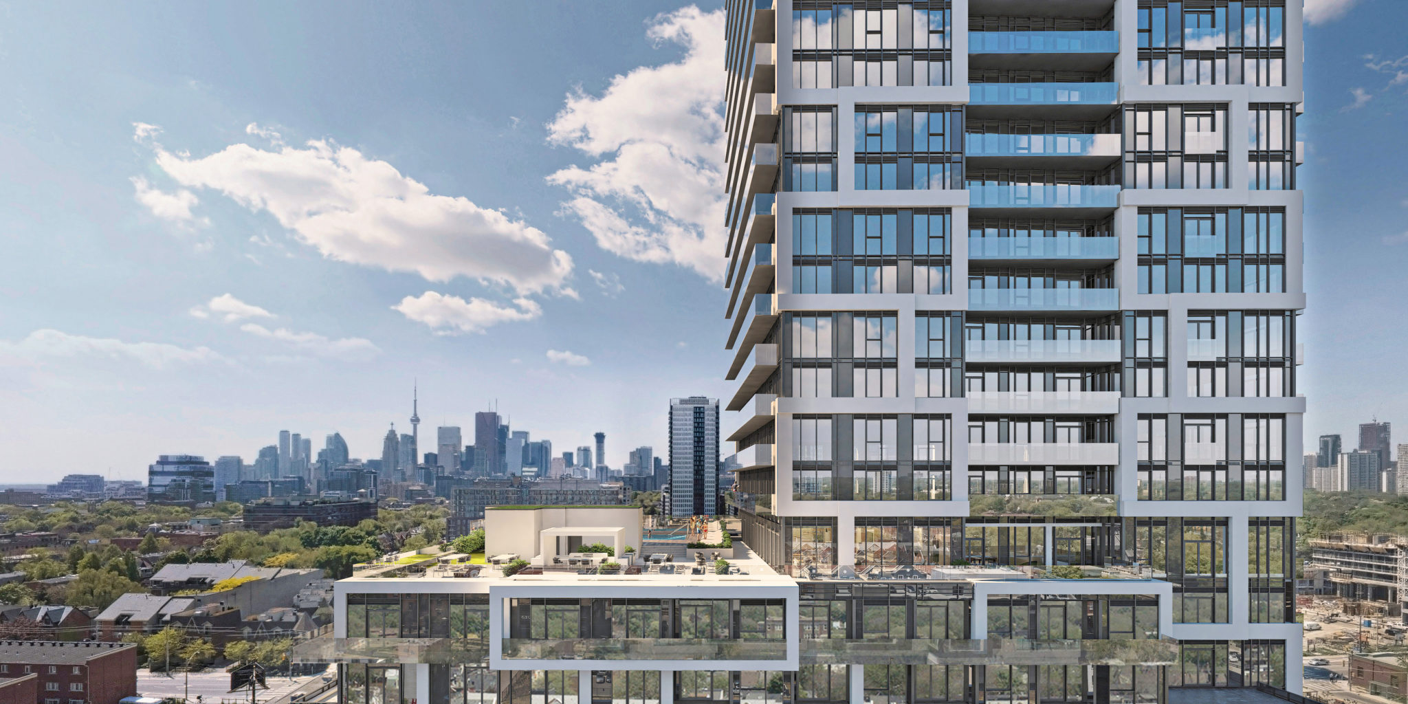 A close-up of River and Fifth Condos on 5 Deffries St with Toronto and CN Tower in background.