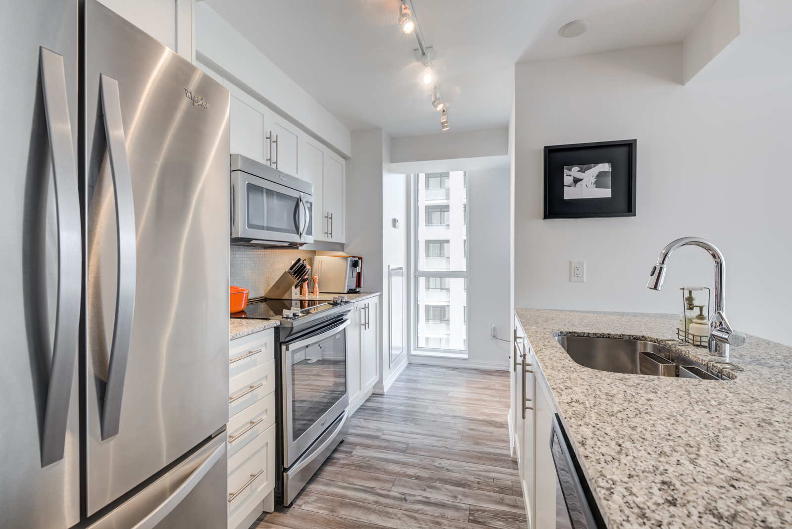 Kitchen and window view of 400 Adelaide St E Unit 704 condos in Moss Park.