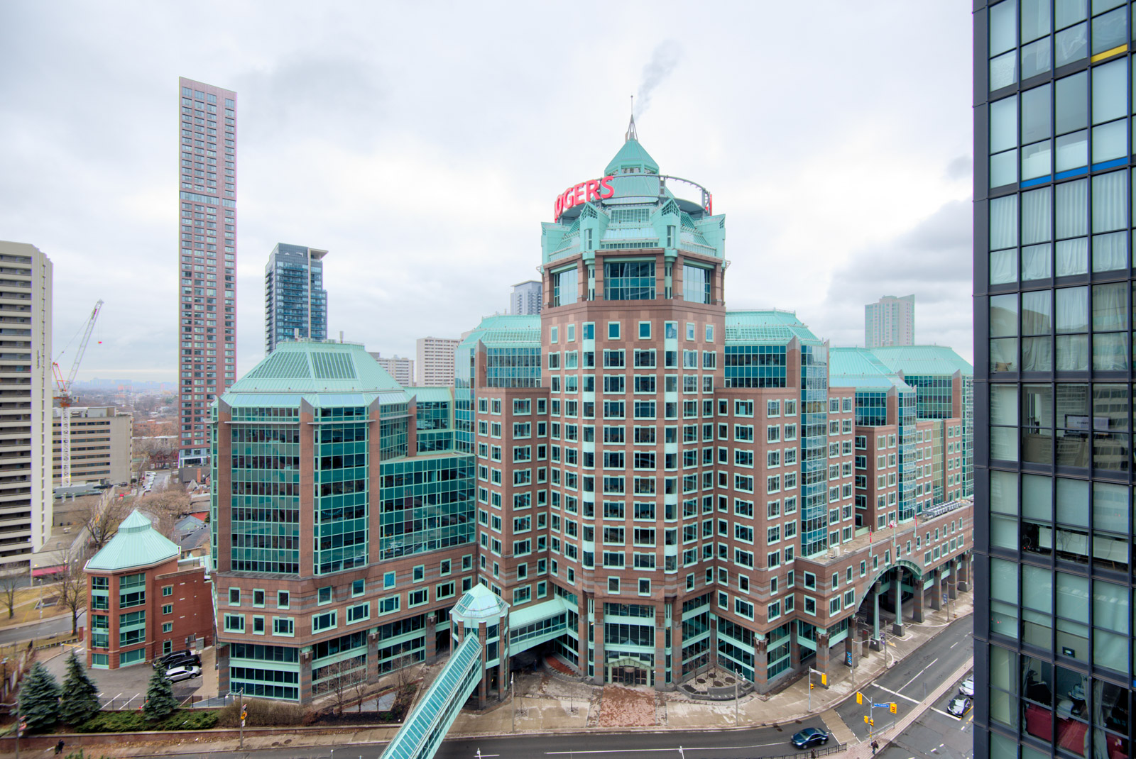 Green-roofs and brown facade of Rogers Building from 28 Ted Rogers Unit 1702 balcony.