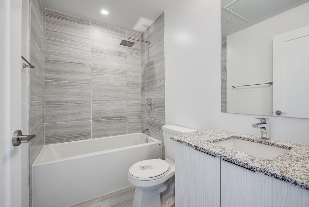 14 condo washroom with white soaker tub