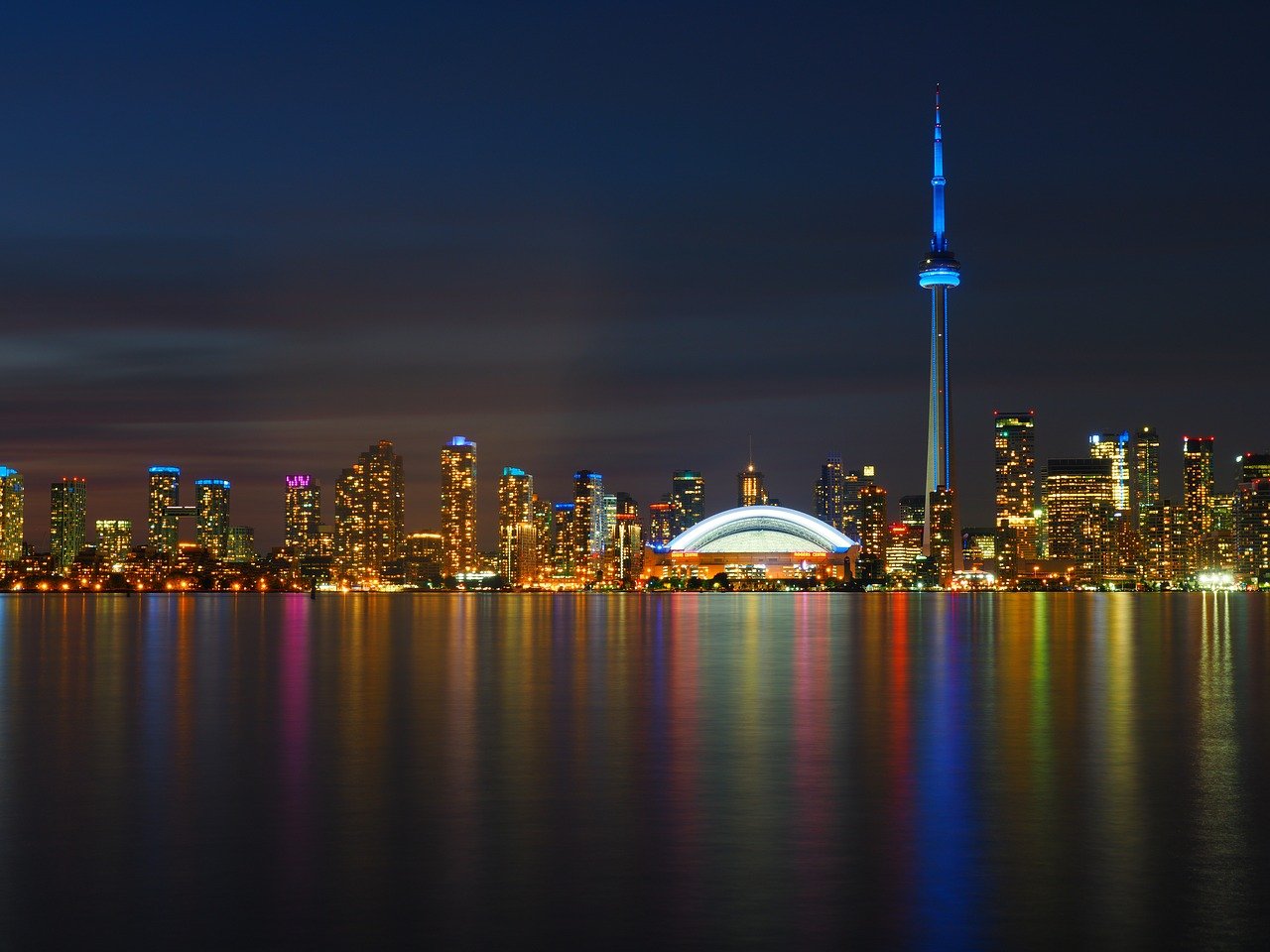 toronto skyline night from lake ontario cn tower blue lights