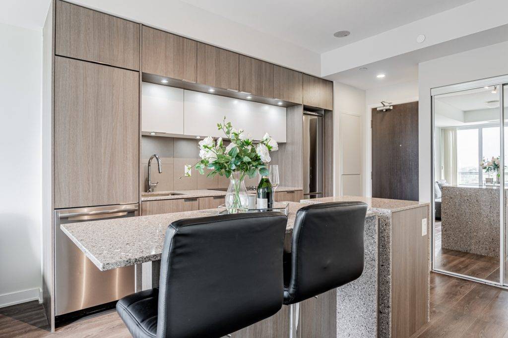 10. condo kitchen with quartz island 55 Regent Park Blvd Suite 1210