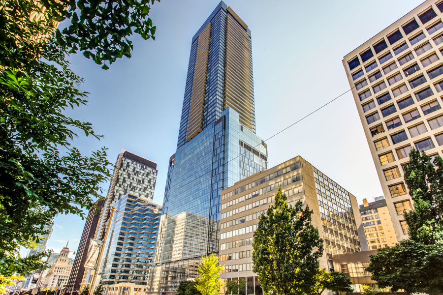 Exterior of 488 University Avenue, a 55-storey condo of blue glass.