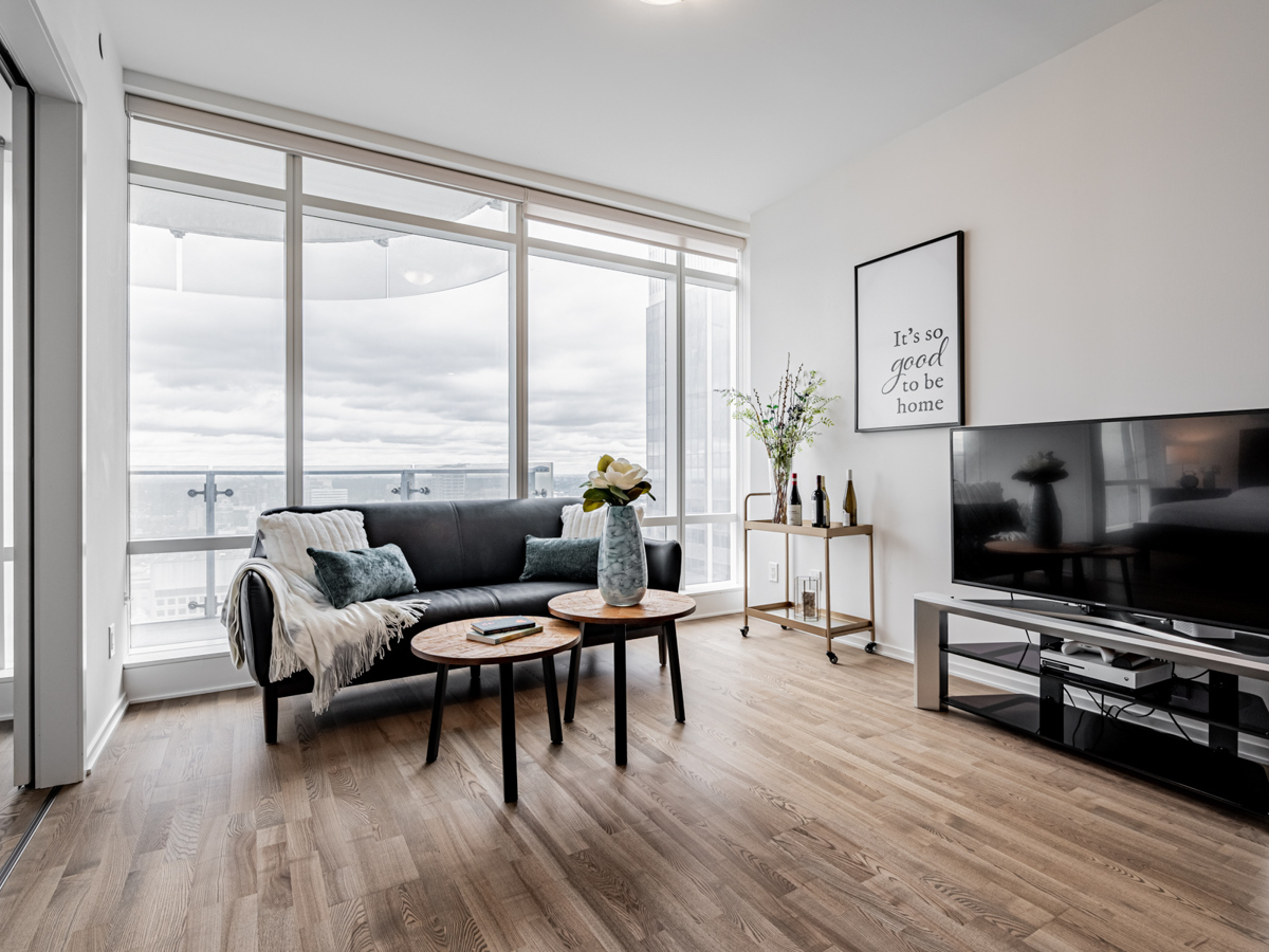 Large windows with view of cloudy skies.