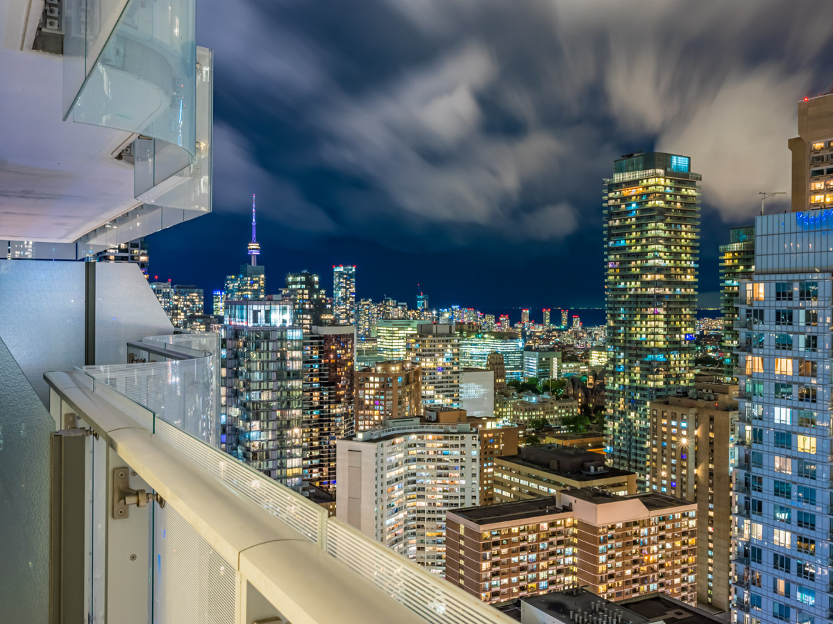 Balcony view of Toronto at night.