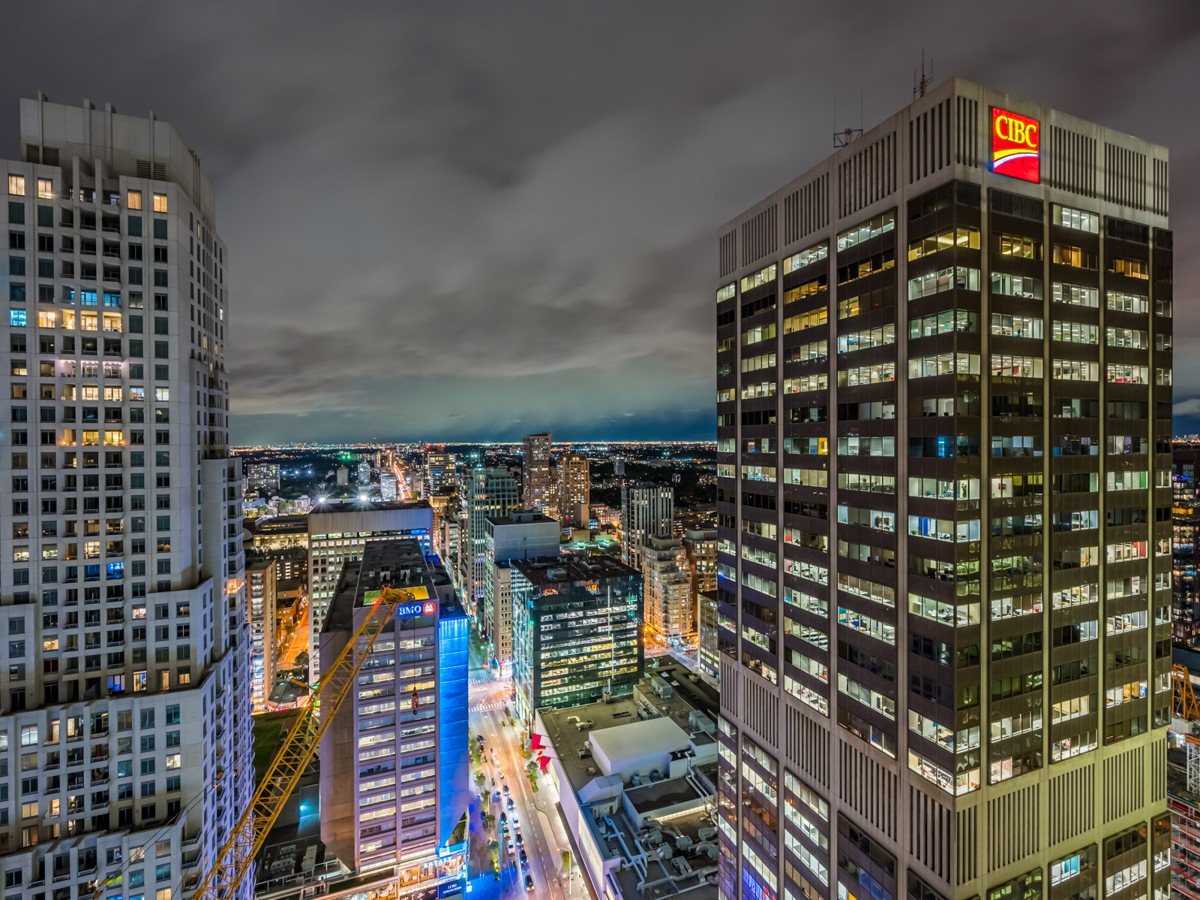 Brightly lit Toronto skyline as seen from 1 Bloor St E Unit 3409 balcony.