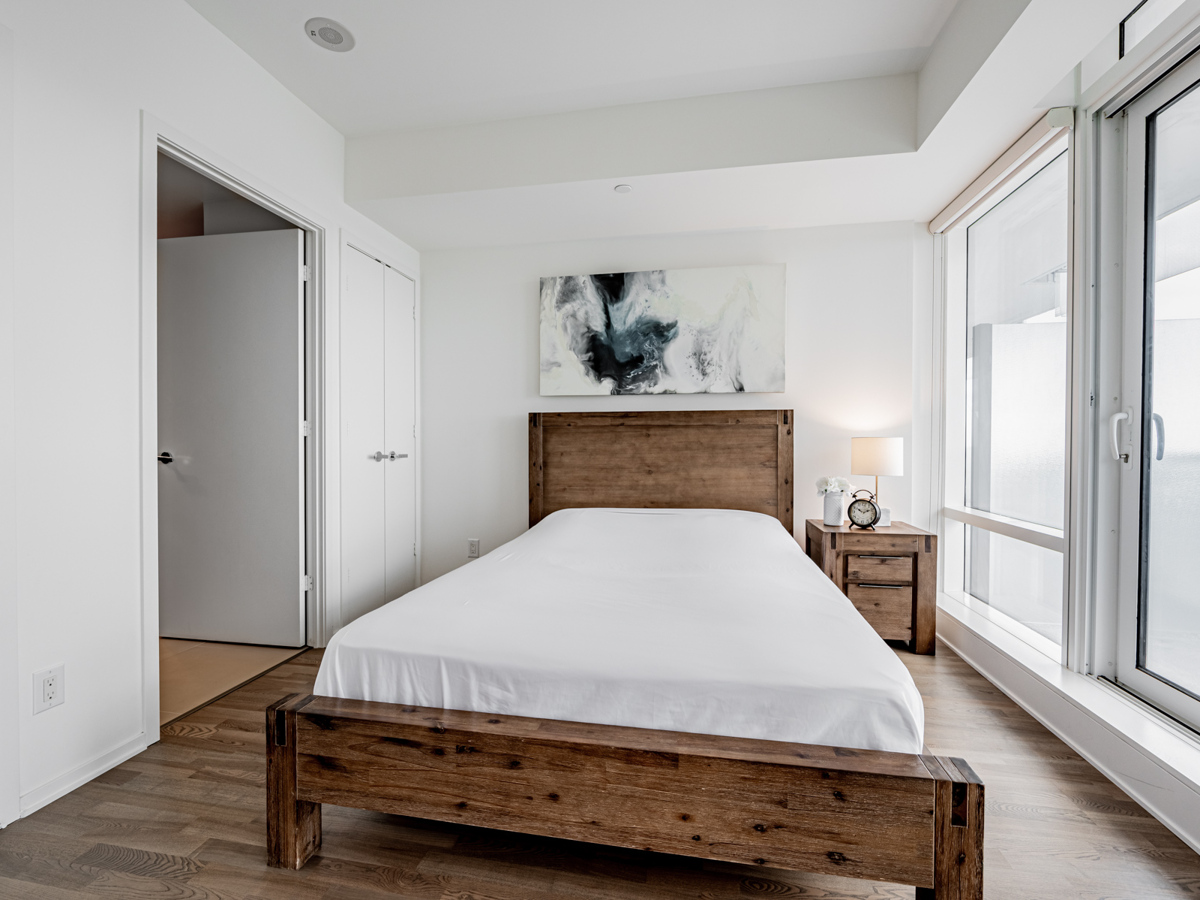 1 Bloor St E Unit 3409 – large primary bedroom.