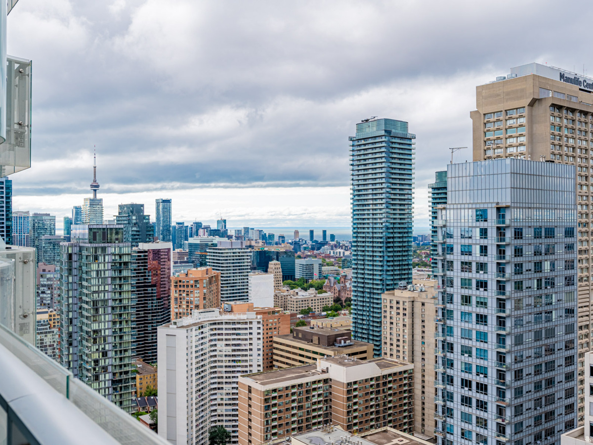 View of CN Tower and Lake Ontario from balcony of 1 Bloor St E Unit 3409.
