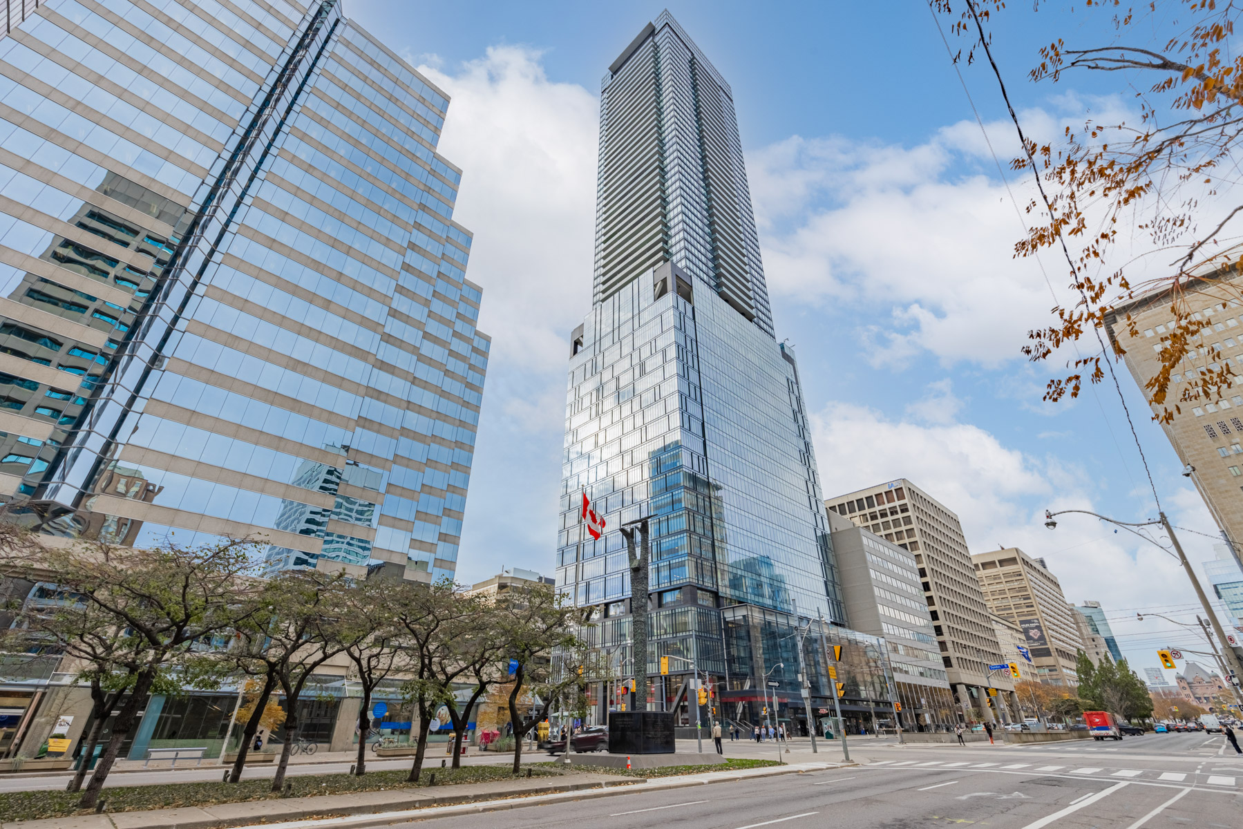 Shiny blue glass and steel exterior of 488 University Avenue condo.