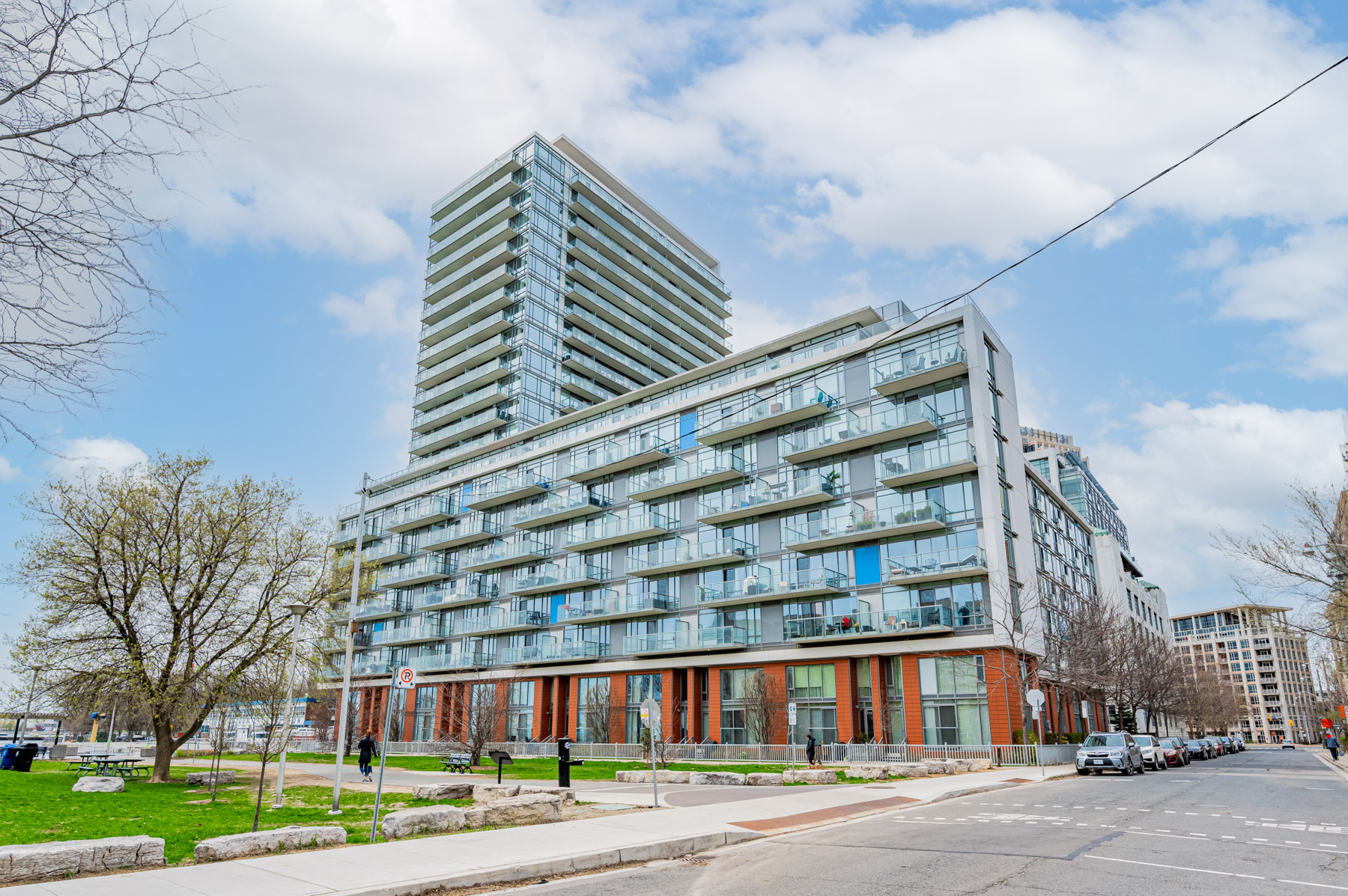 23-storey condo of steel and glass with 8-storey podium – Quay West Condos.