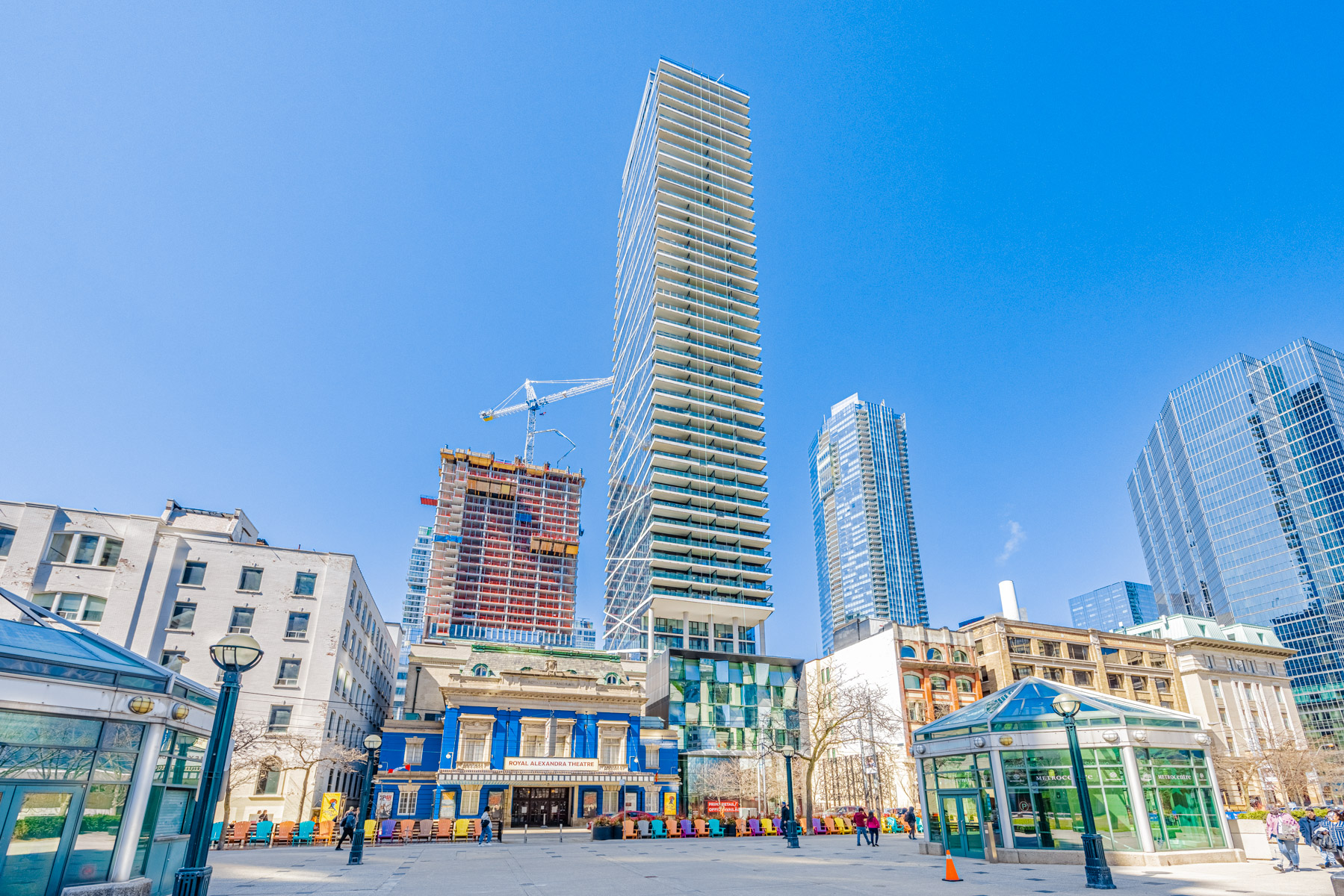 View of Theatre Park Condos next to blue coloured Royal Alexandra Theatre.