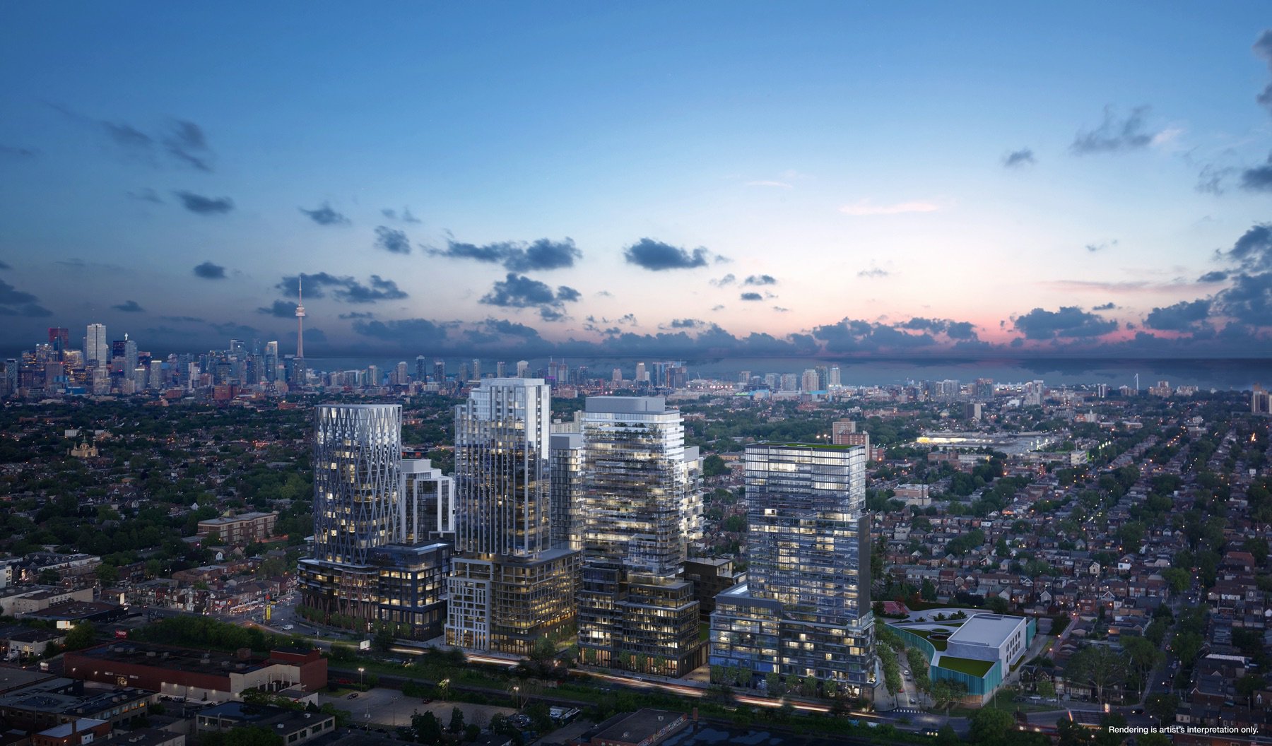 Night view of Galleria On The Park Condos surrounded by houses and buildings; CN in background.