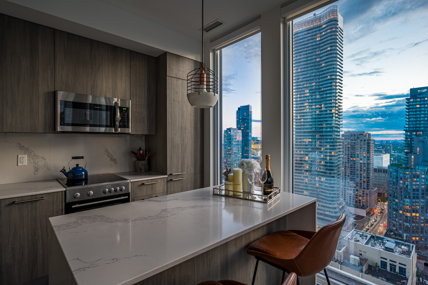 View of Toronto from 28 Wellesley St Unit 3009 kitchen island.