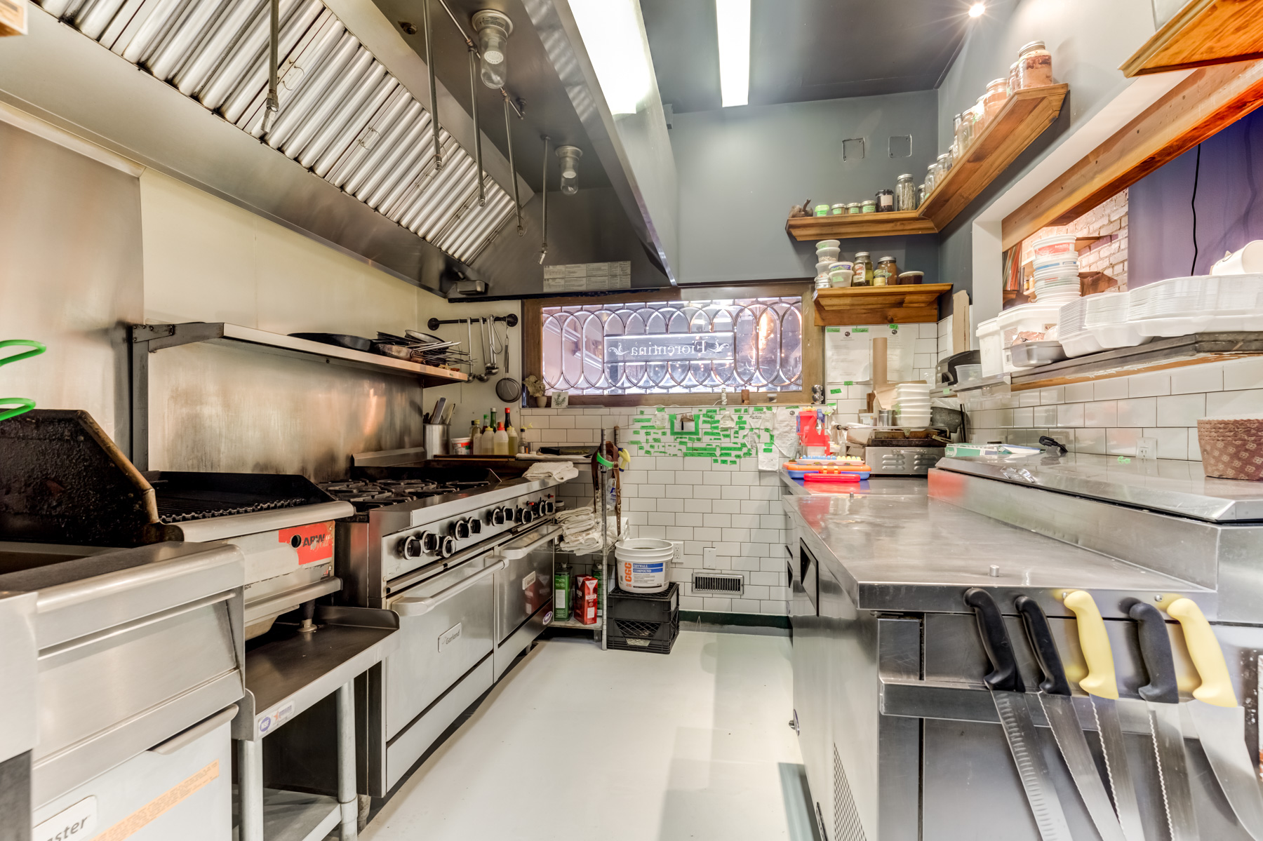 Restaurant kitchen with industrial stove.