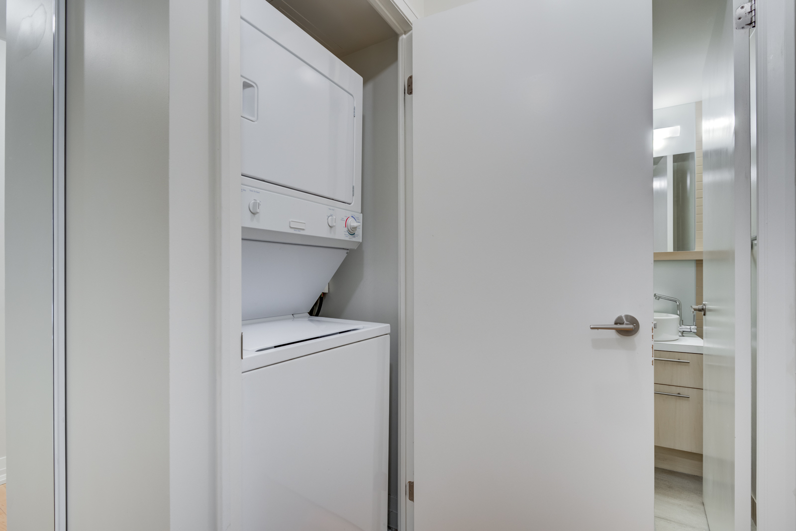 Washer and dryer in laundry closet of 25 Carlton St Unit 401.