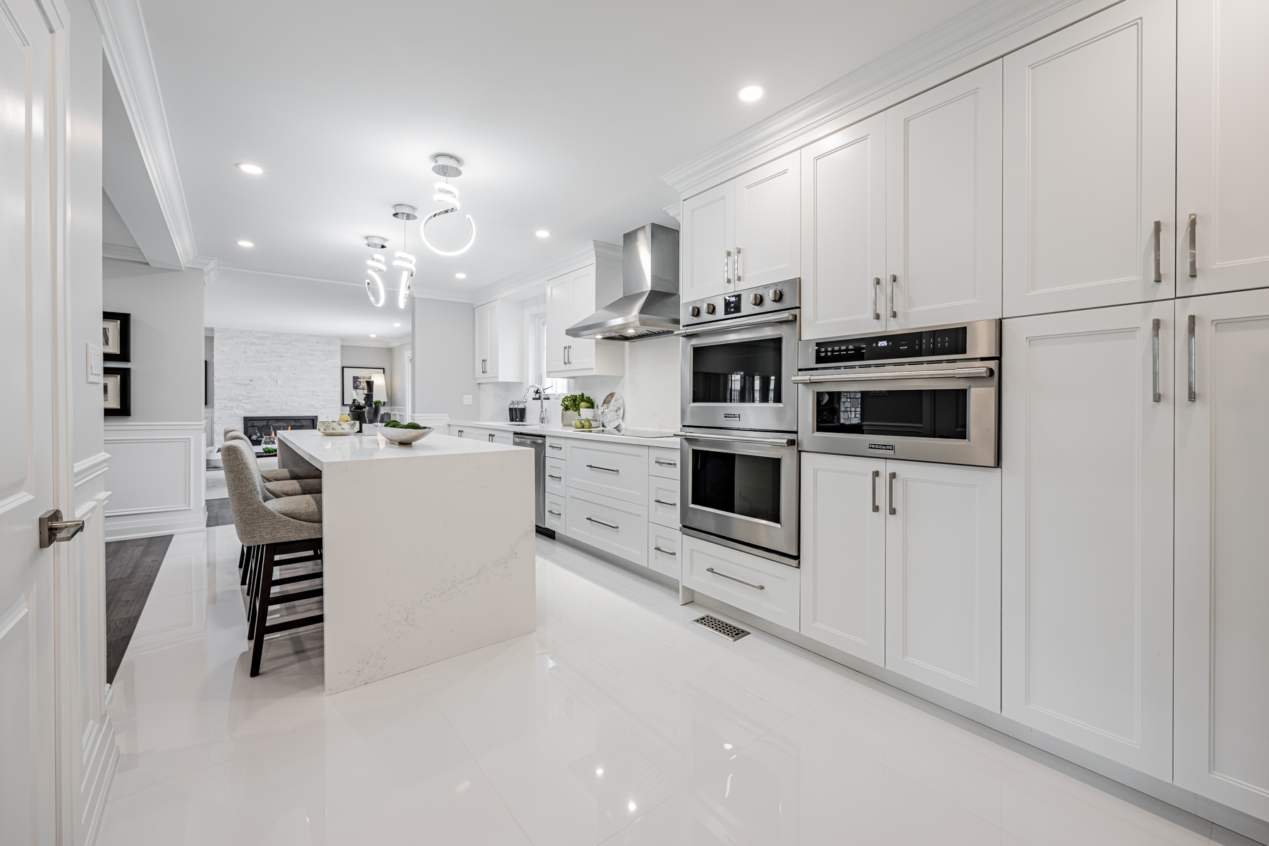 Brand new kitchen with smooth gray and white colour scheme.