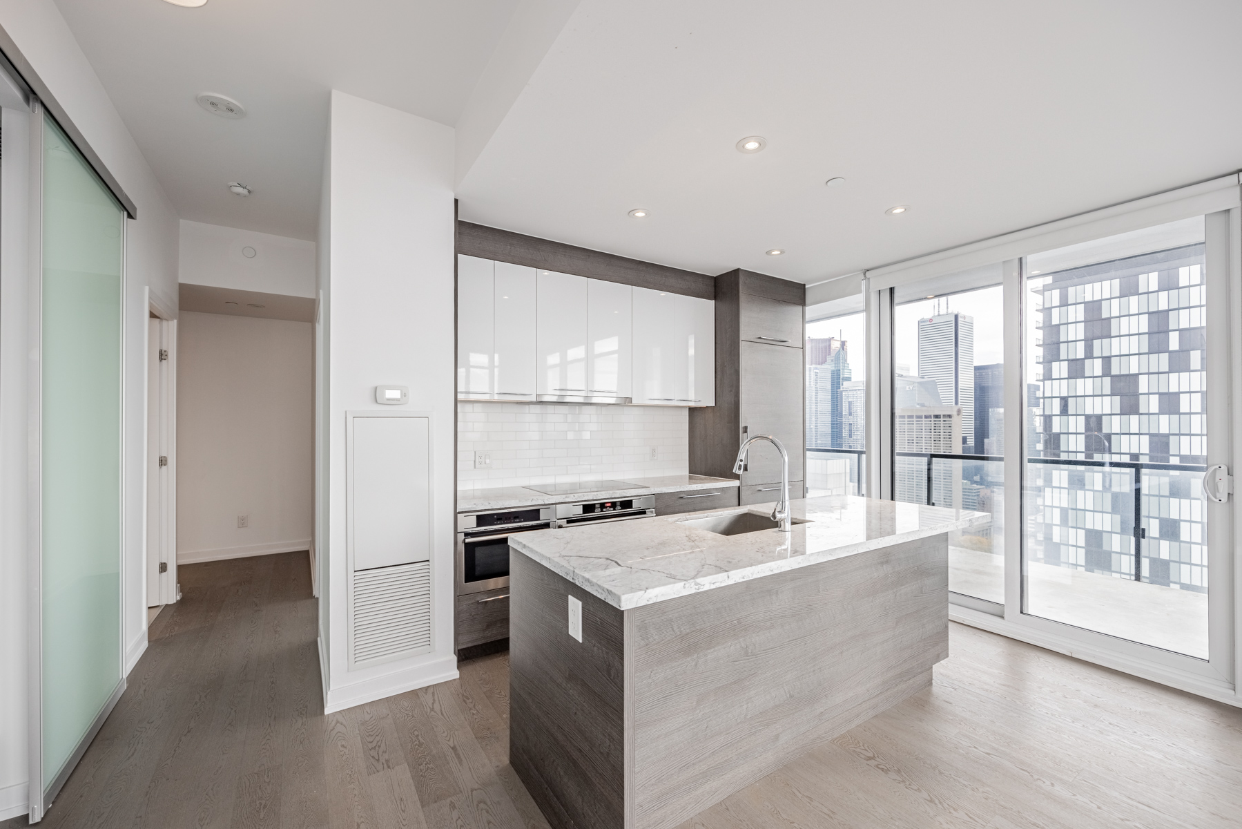 Marble kitchen island with protruding countertop.