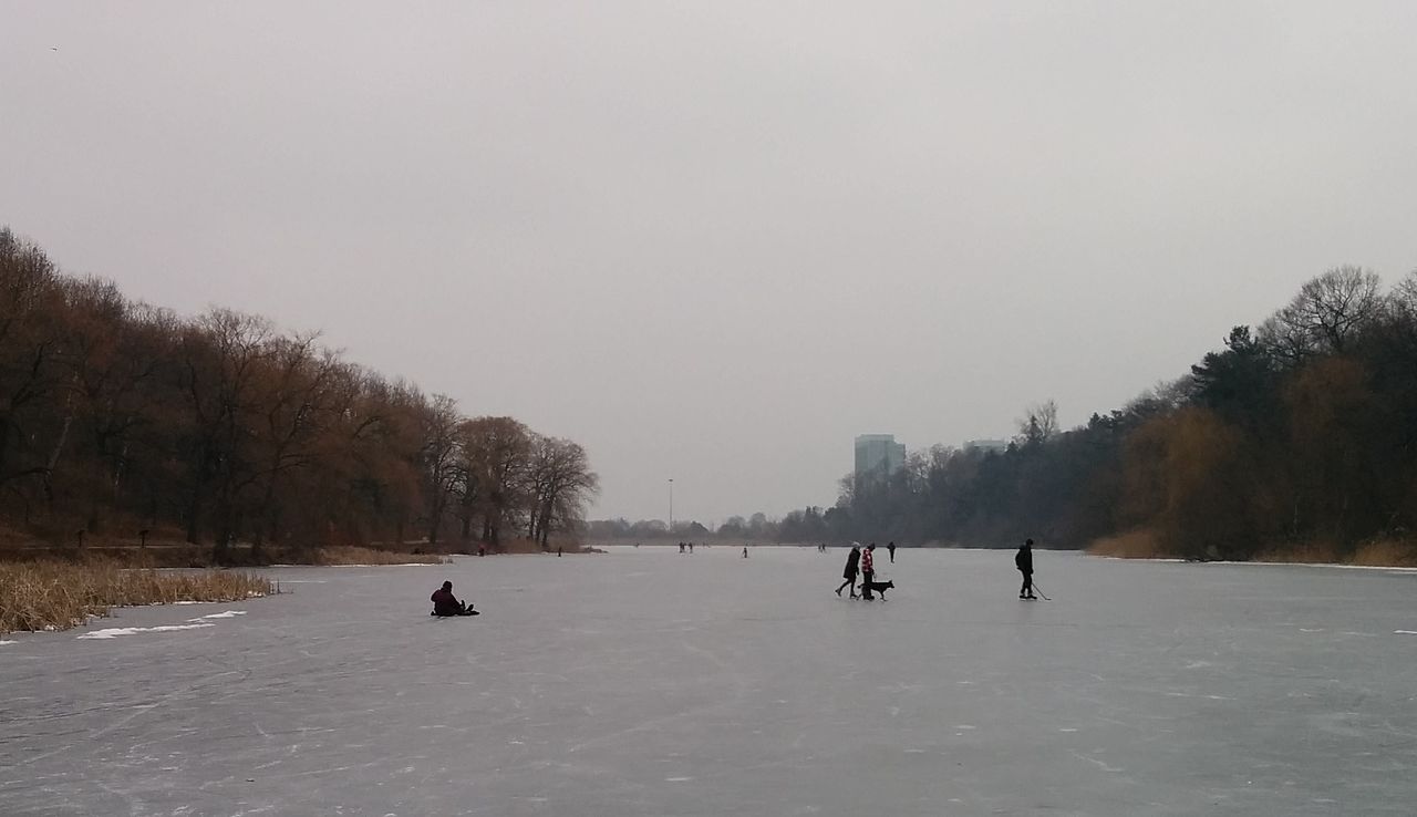 People ice-skating at High Park in Toronto.