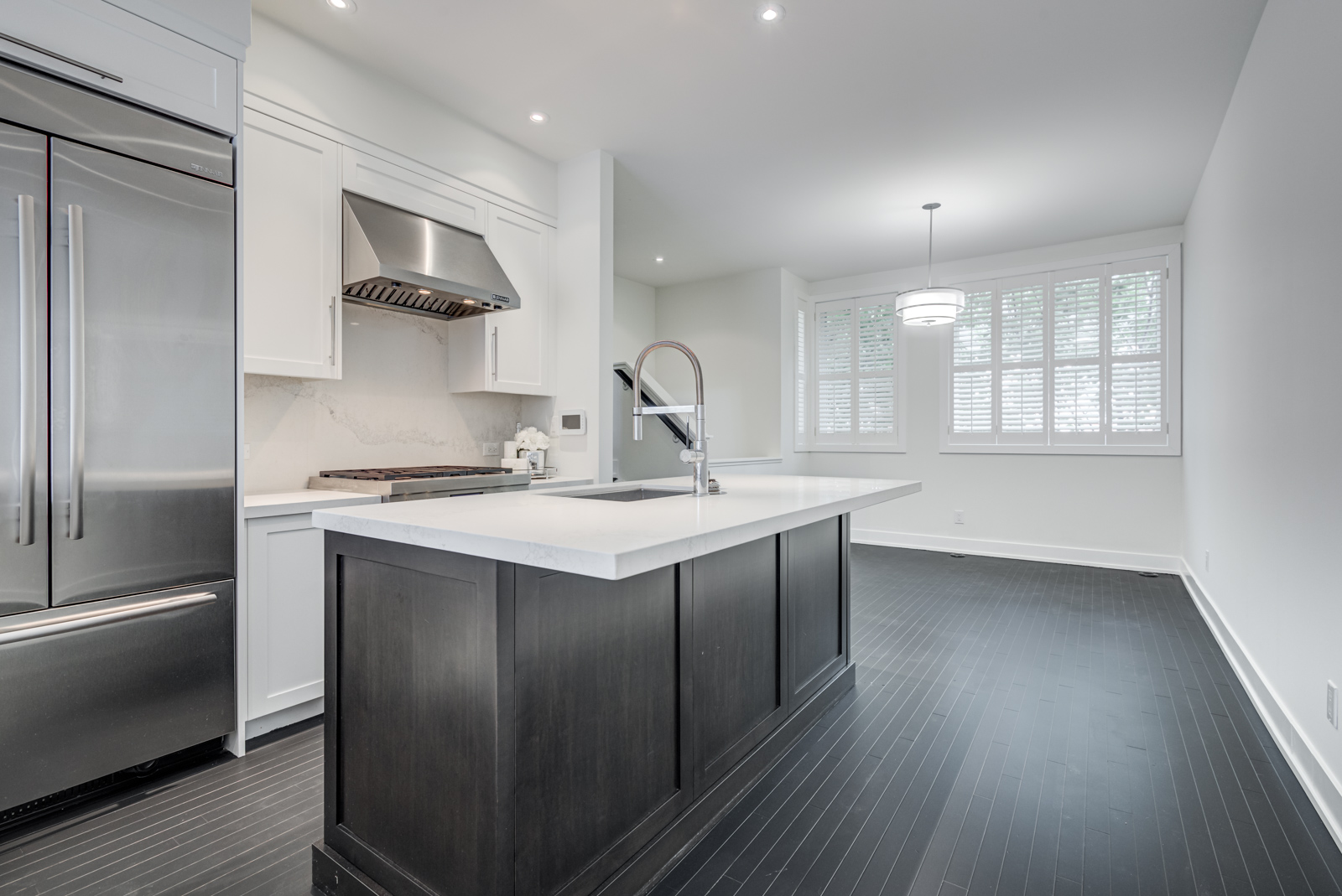 kitchen island with black base and white counters