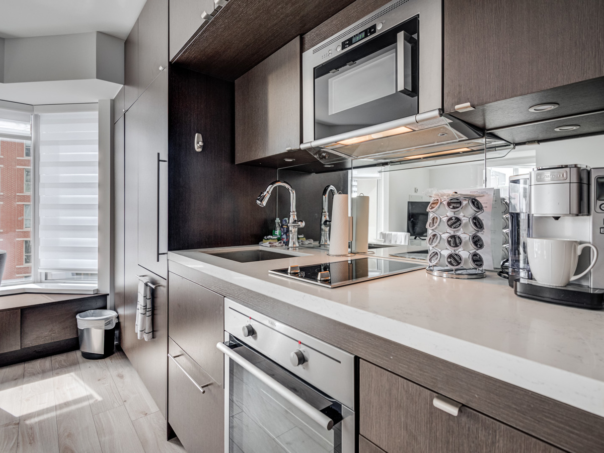 Close up of 155 Yorkville Ave Unit 1614 kitchen back-splash and under-cabinet lights.