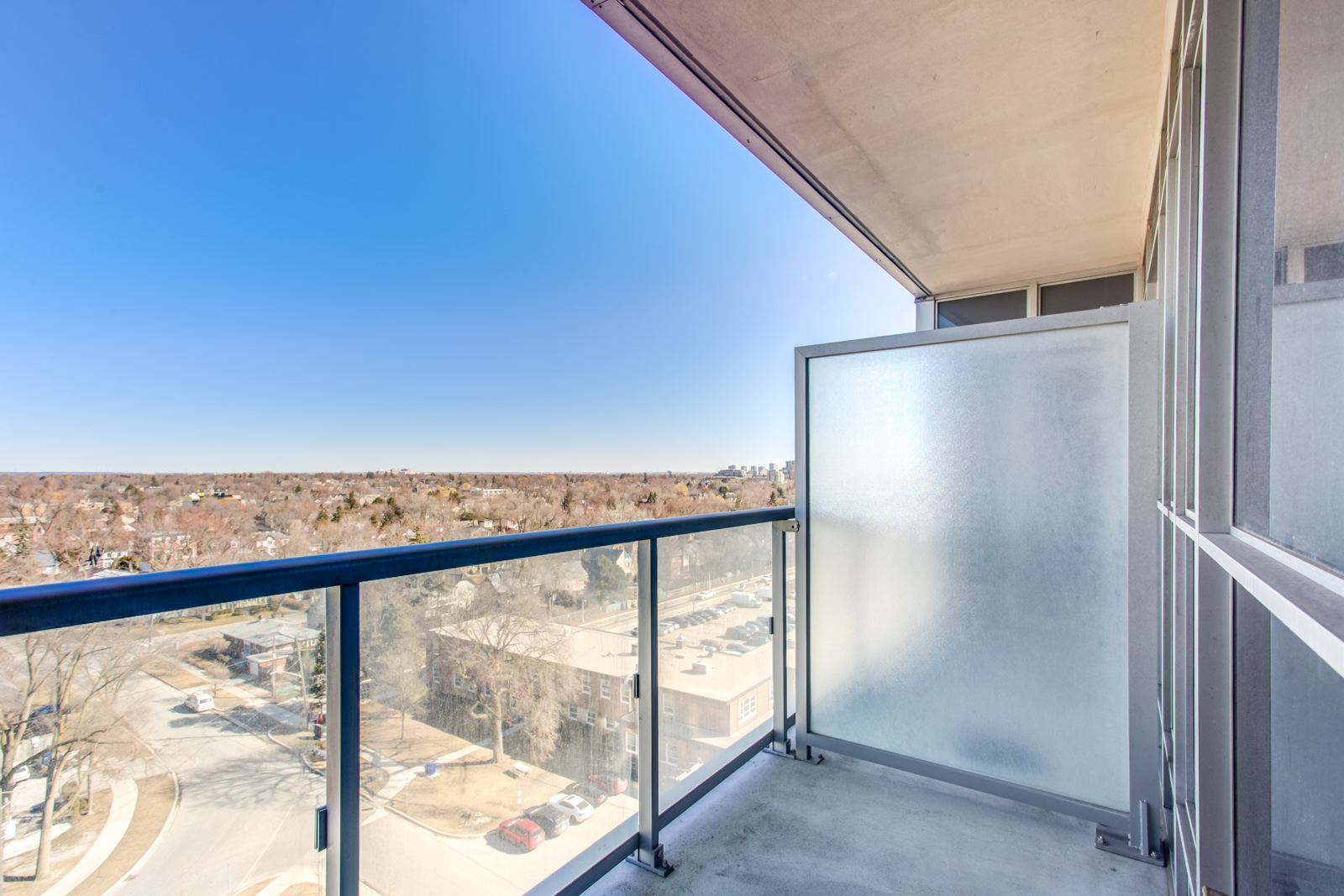Photo of 120 Harrison Garden Unit 1025 balcony and its glass panels.