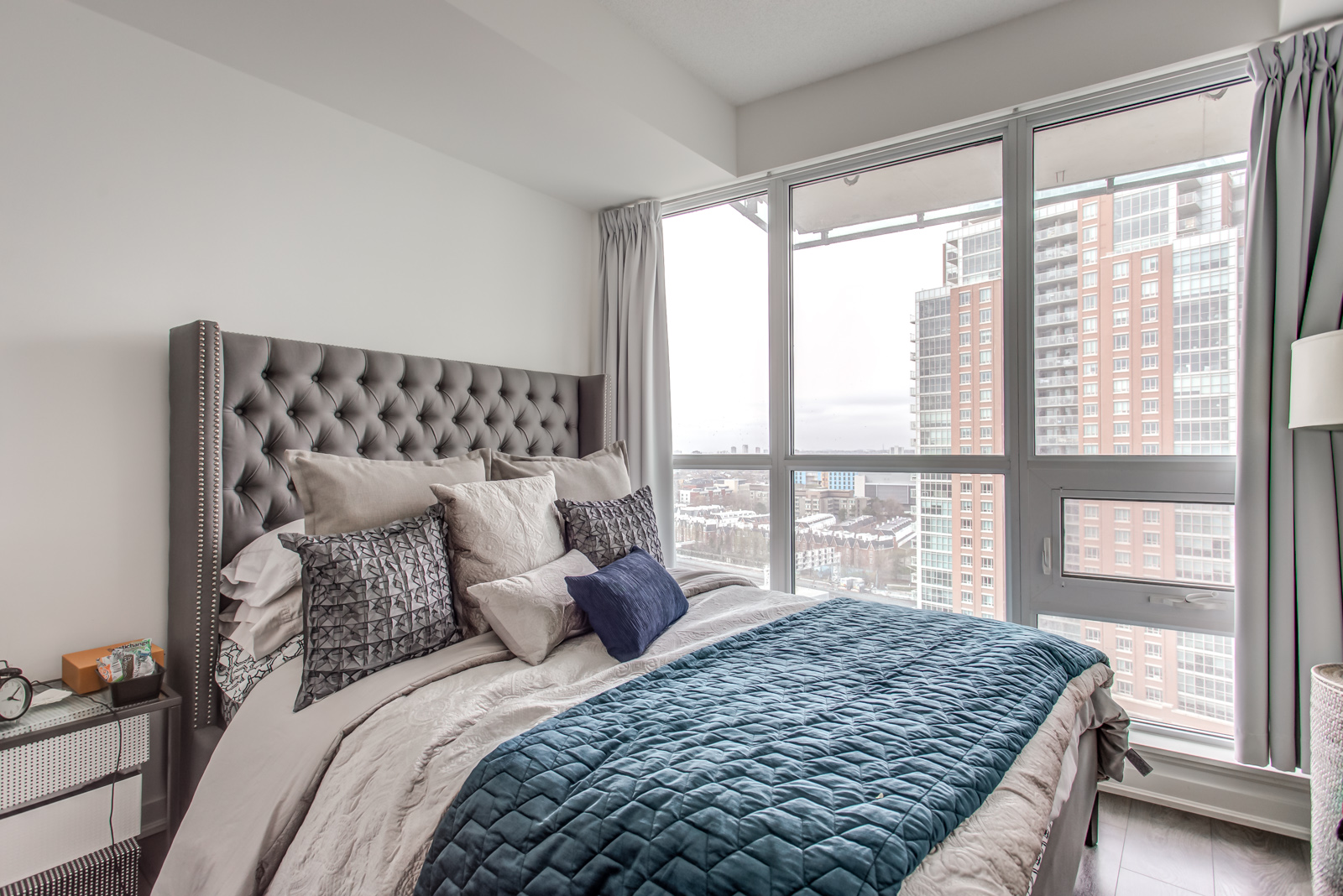 Bedroom and large windows of 150 East Liberty St Unit 1616.