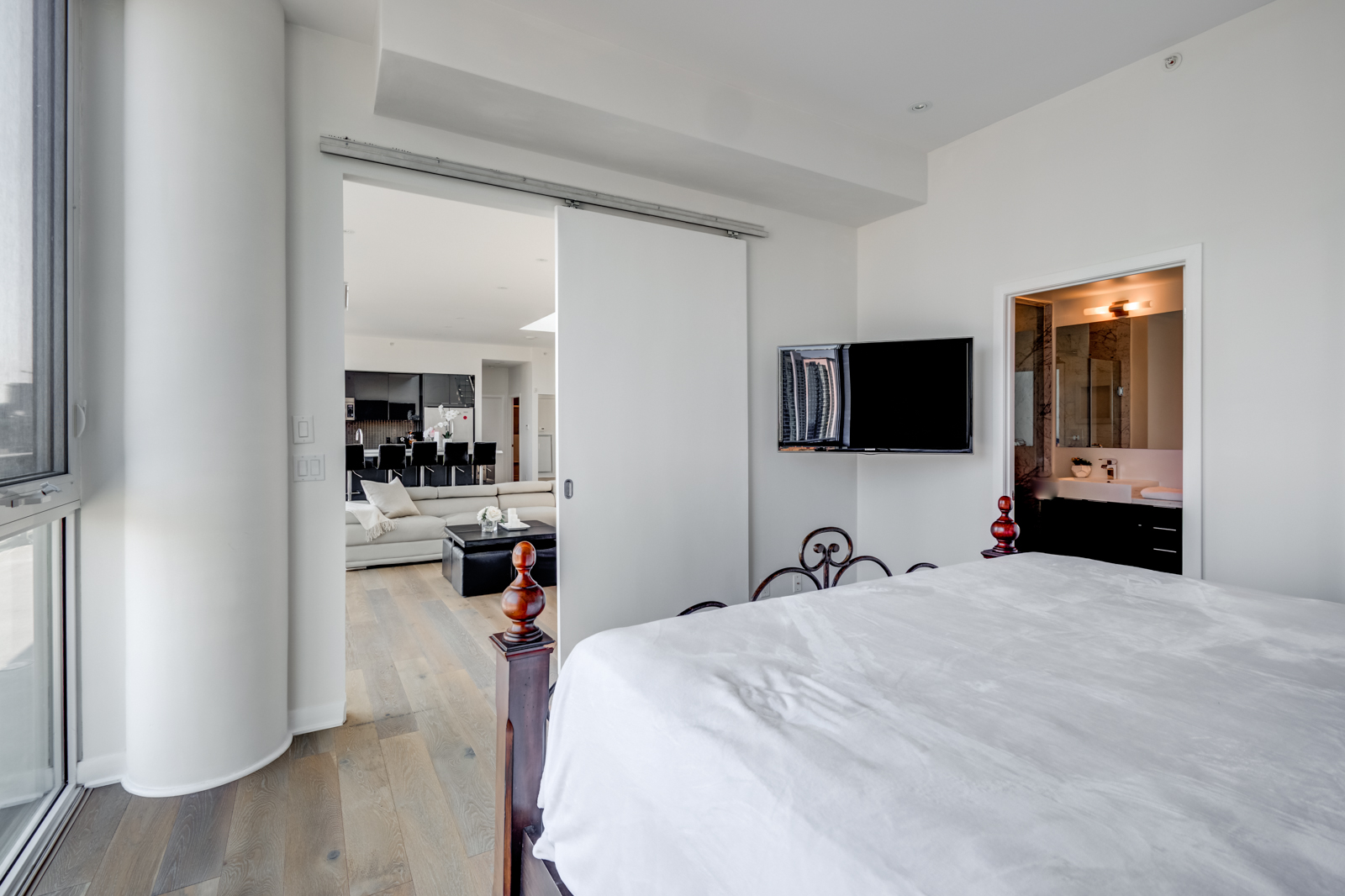 Sliding door shot of master bedroom at Victory Lofts Penthouse Suite in 478 King St W Toronto.