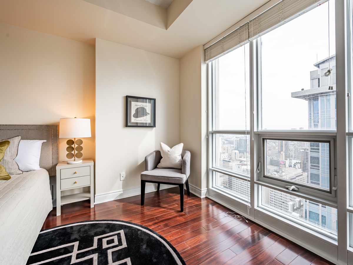 Bright floor-to-ceiling windows with view of downtown Toronto.