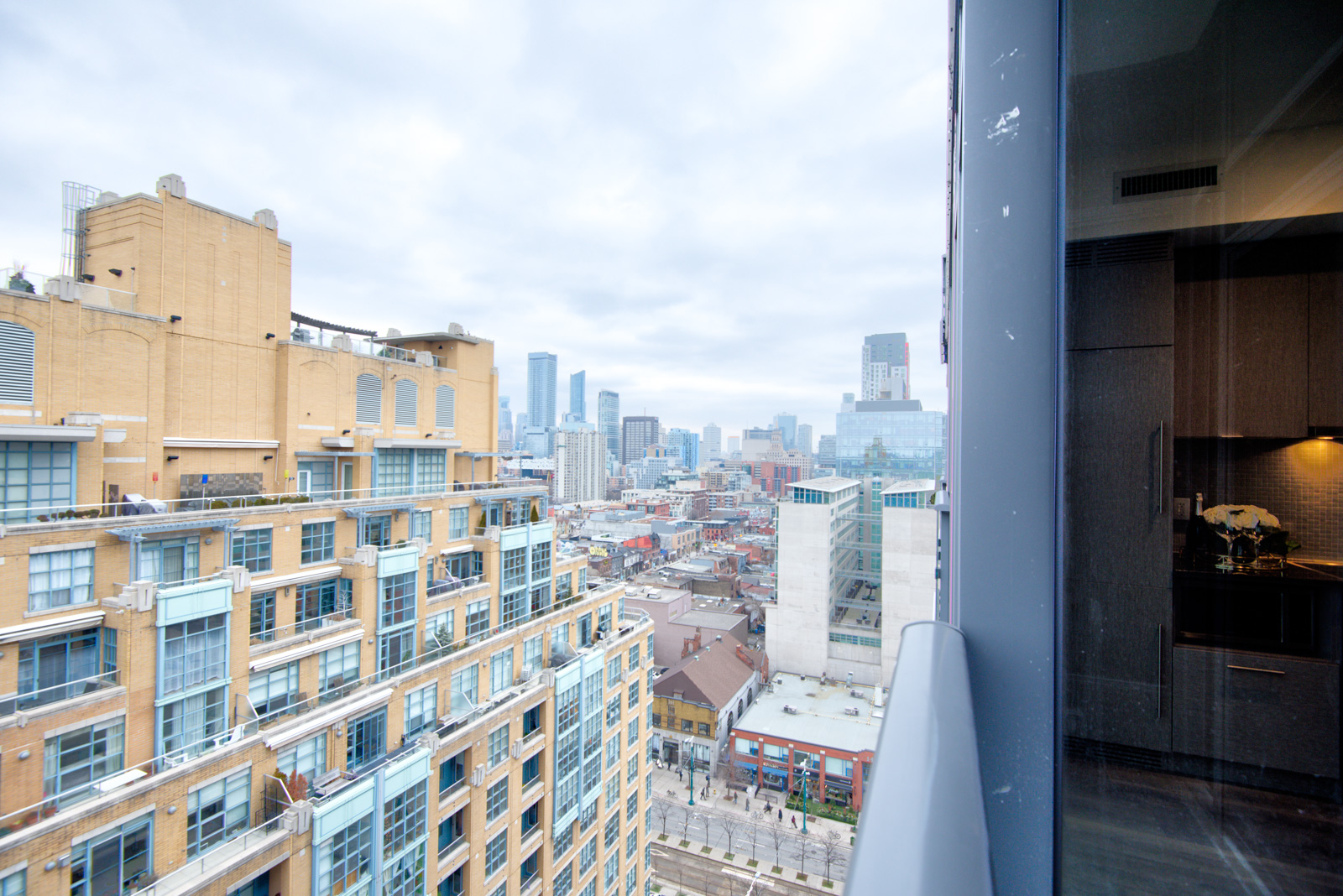 The penthouse suite balcony showing buildings and streets of the Fashion District.