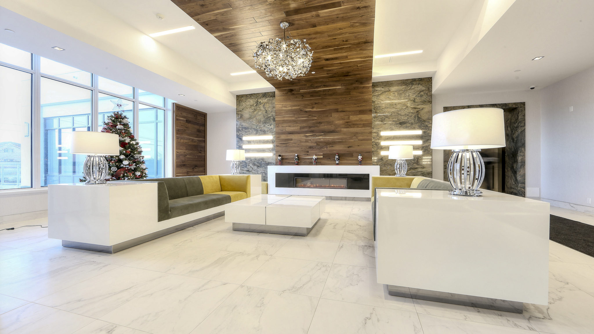 Image of condo lobby. Everything is so gorgeous and sleek. There is a mix of wood and other materials, making it look almost classic.