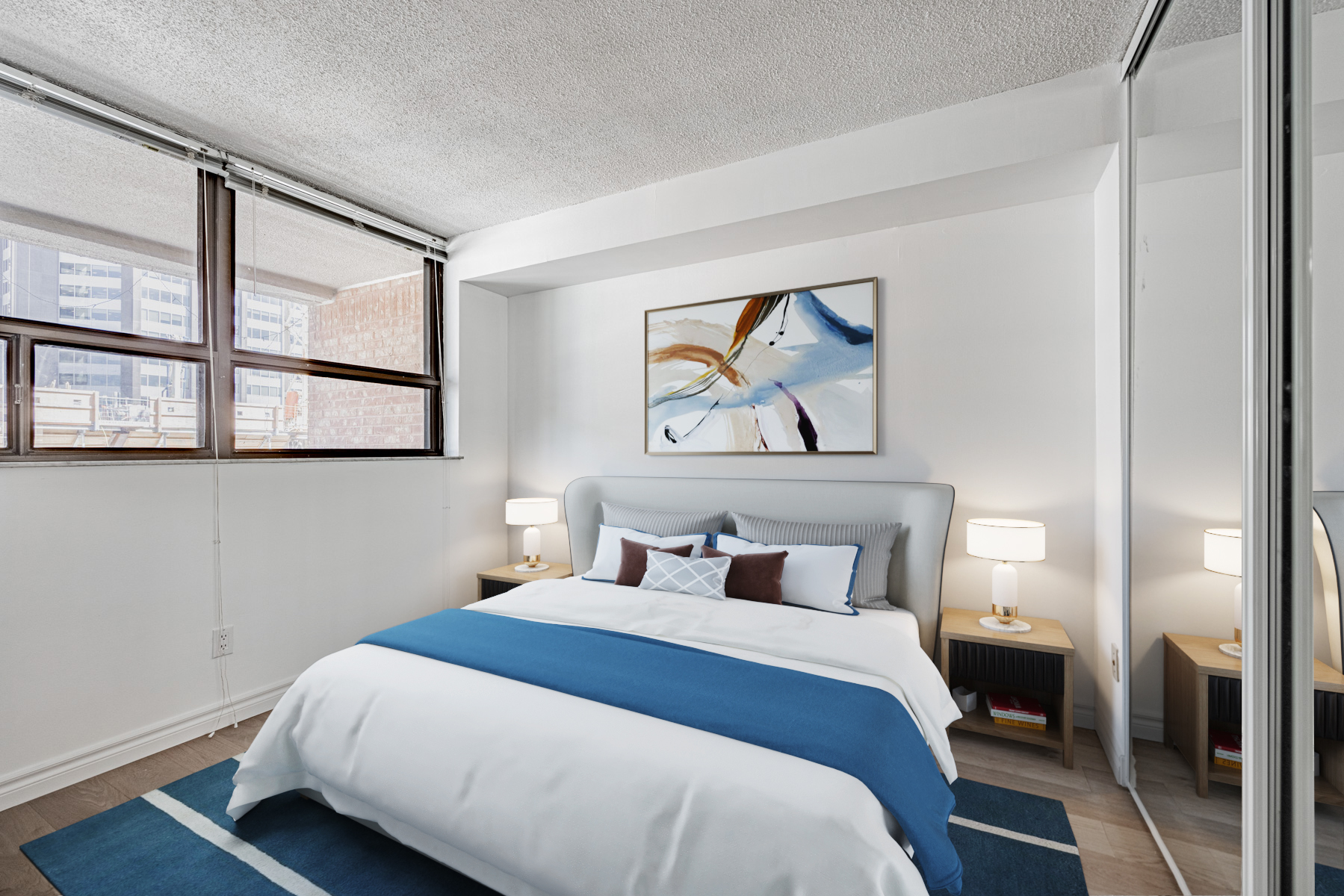 Newly painted 120 St. Patrick Unit 807 primary bedroom with hardwood floors.