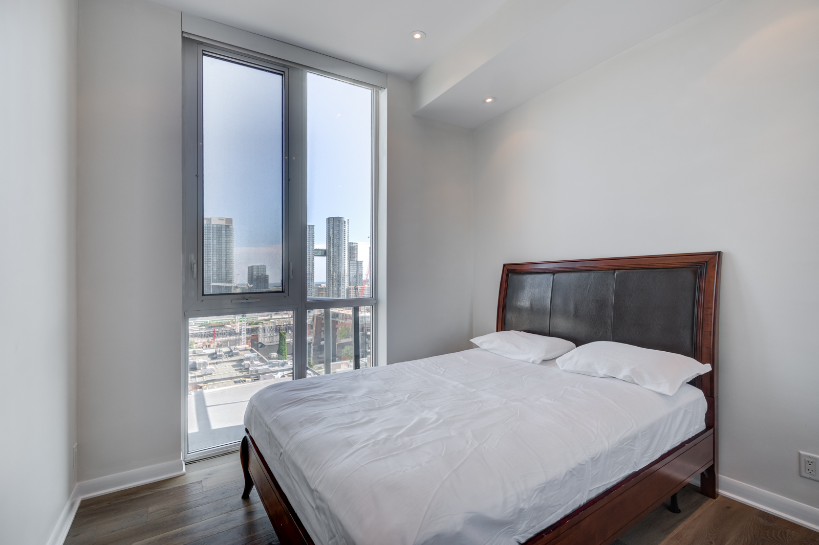 2nd bedroom and window view of Victory Lofts Penthouse Suite in 478 King St W Toronto.