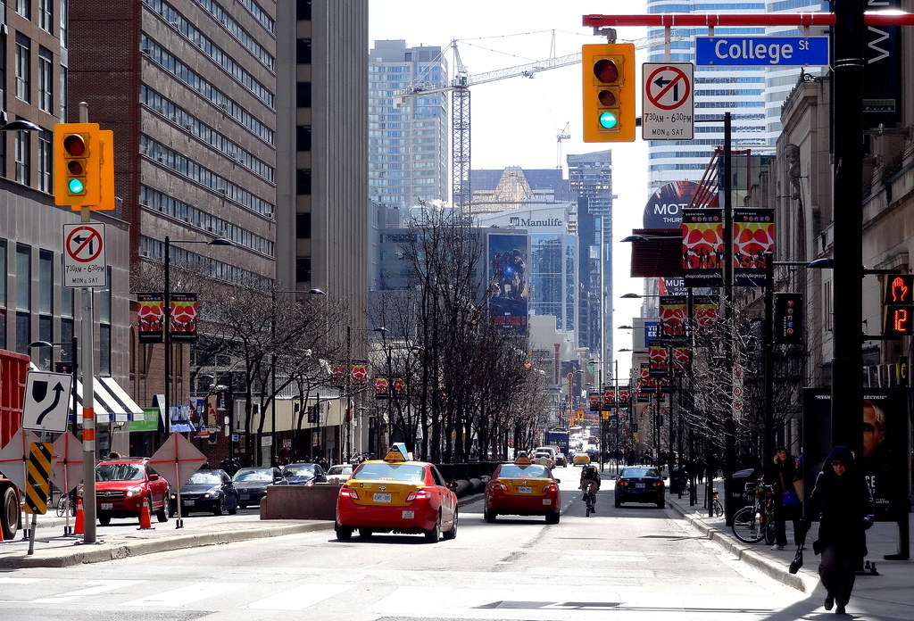 Image of Yonge and College Street in Toronto during day time.