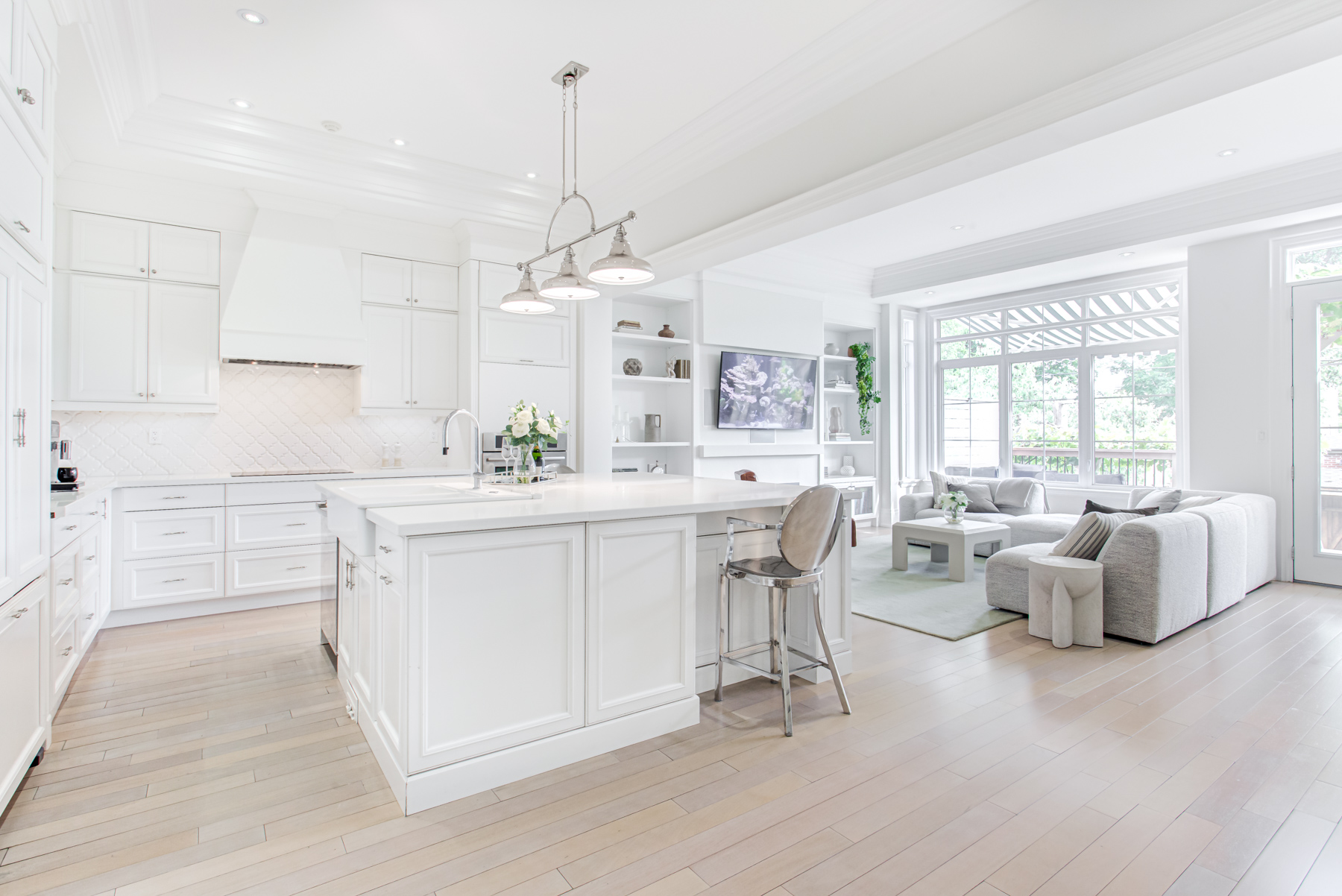 House kitchen with shiny kitchen counters and cabinets.