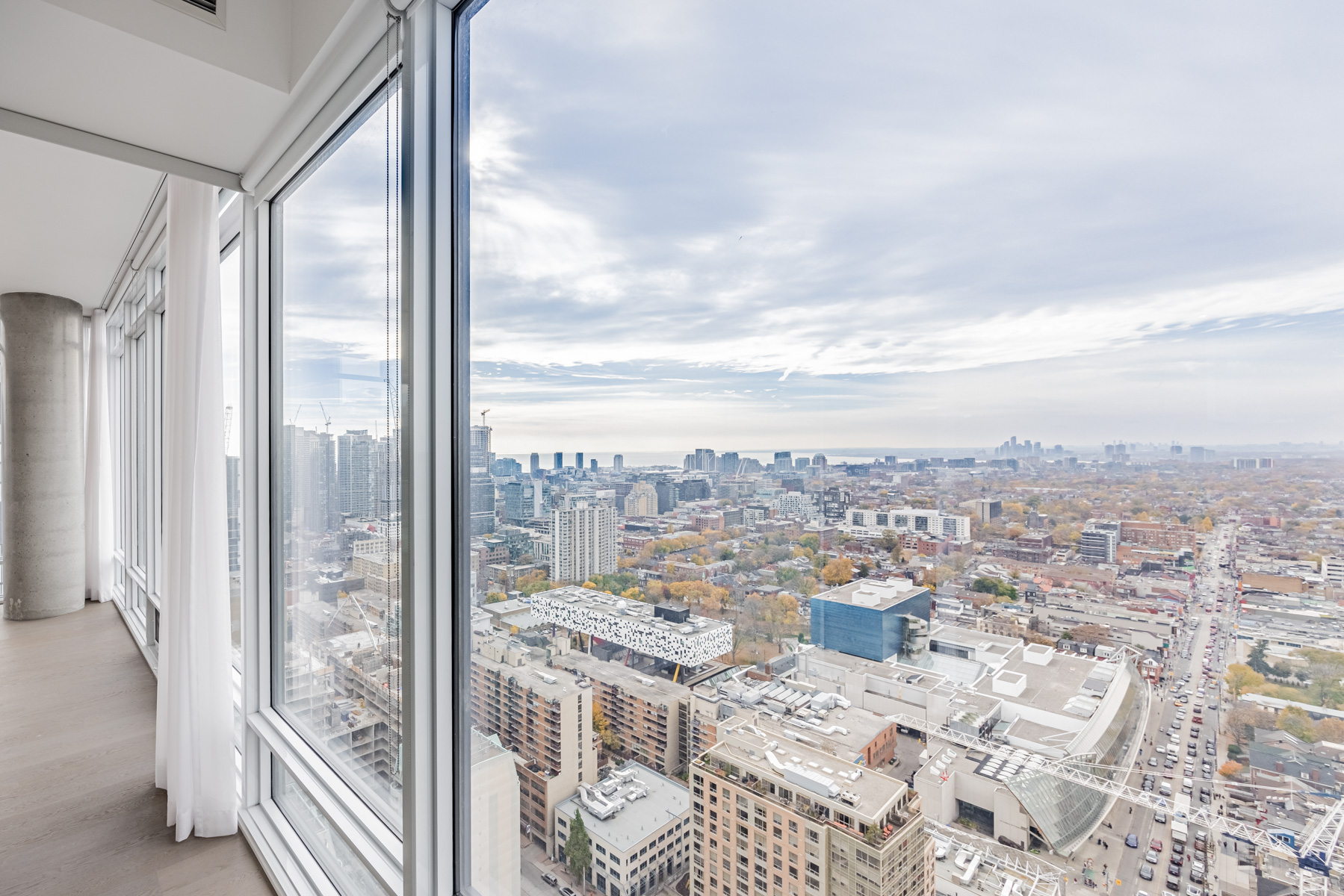 View of Toronto's Art Gallery of Ontario, OCAD University and Lake Ontario from condo bedroom.