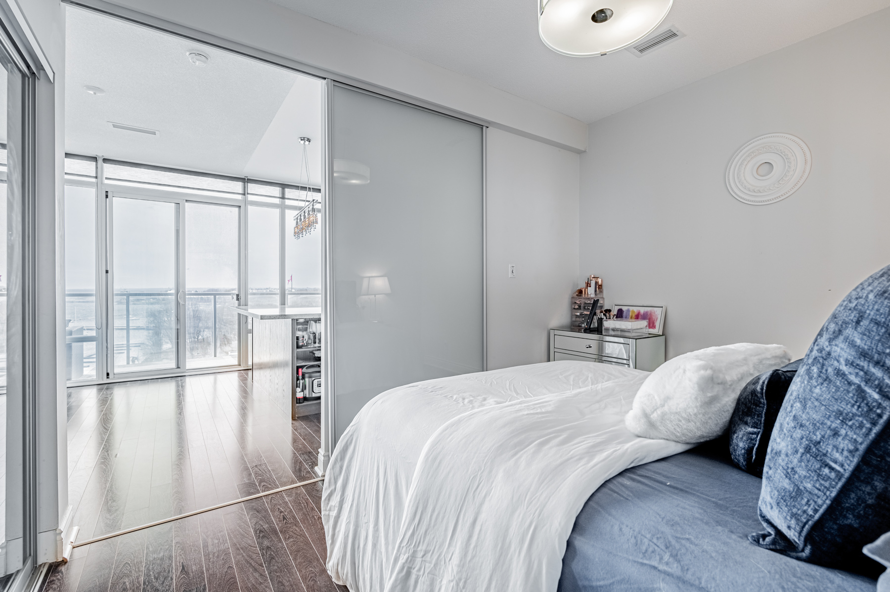 Condo bedroom with sliding door.