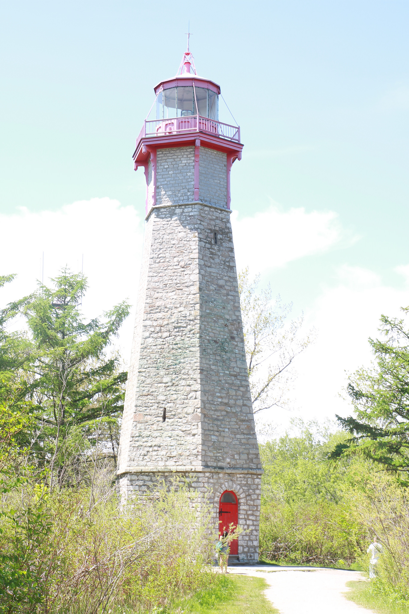 Photo of lighthouse at Gibraltar's Point and trees.