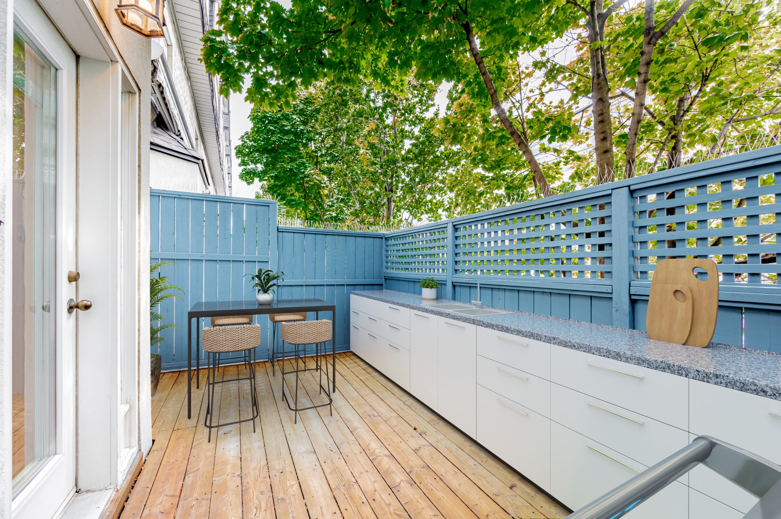 Deck with counters and blue fence.