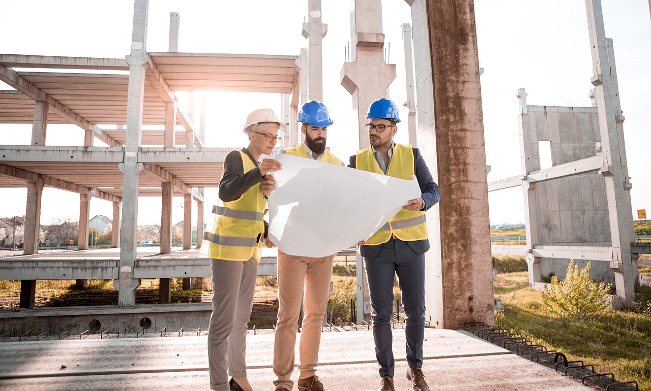 Builder and planners at build site