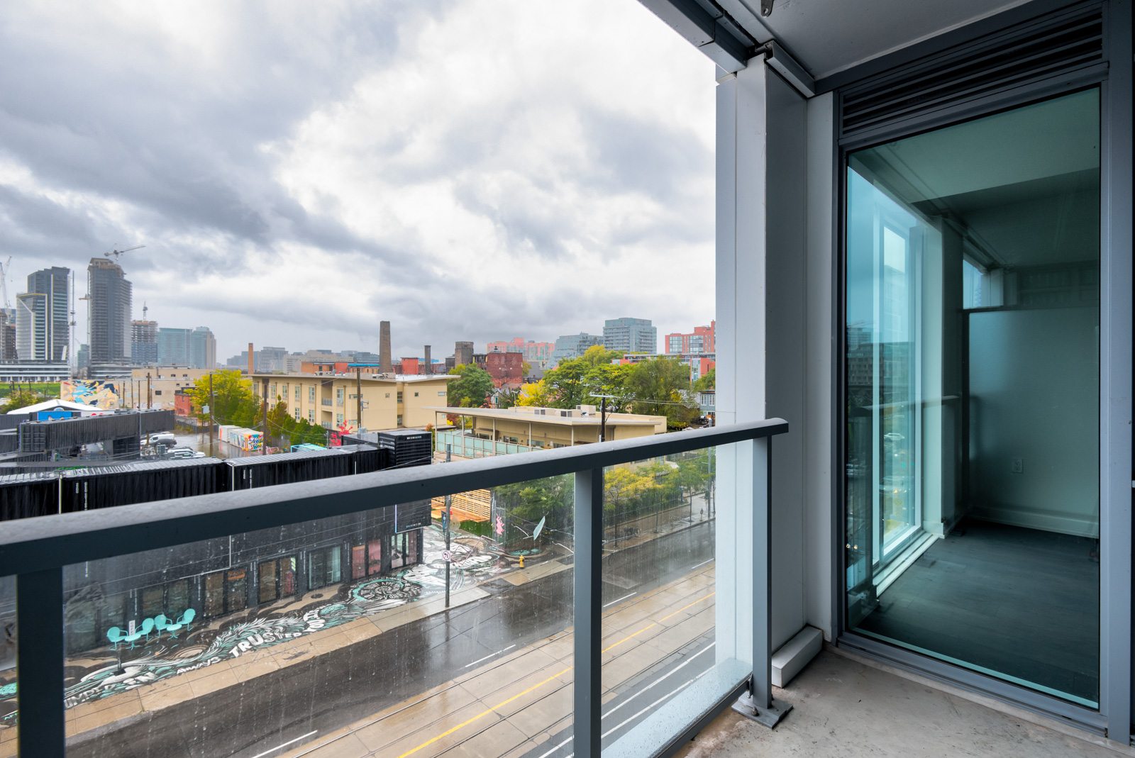 Balcony of Minto Condos overlooking Bathurst St, Toronto on a rainy day.