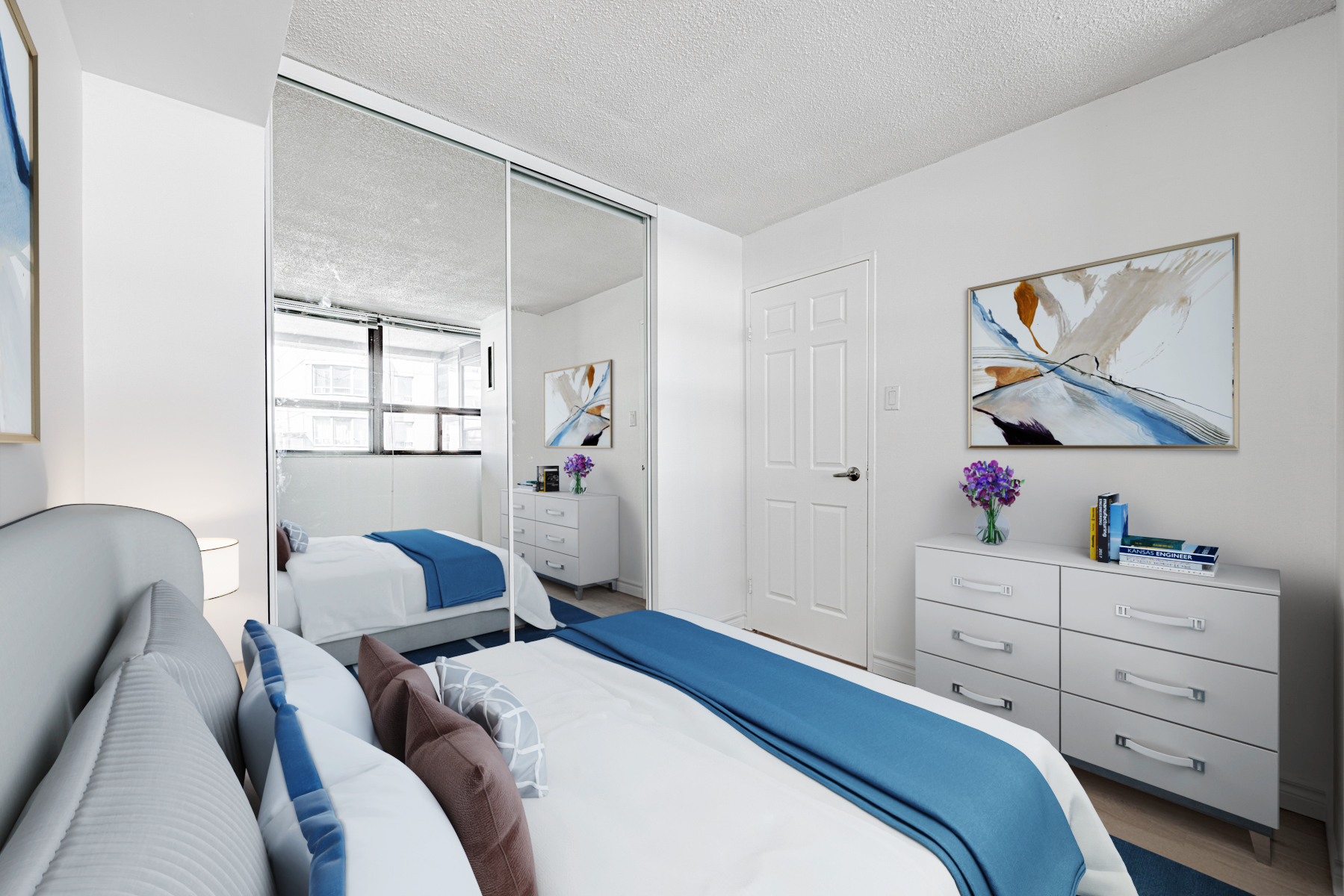 Condo bedroom with large mirror door closet.