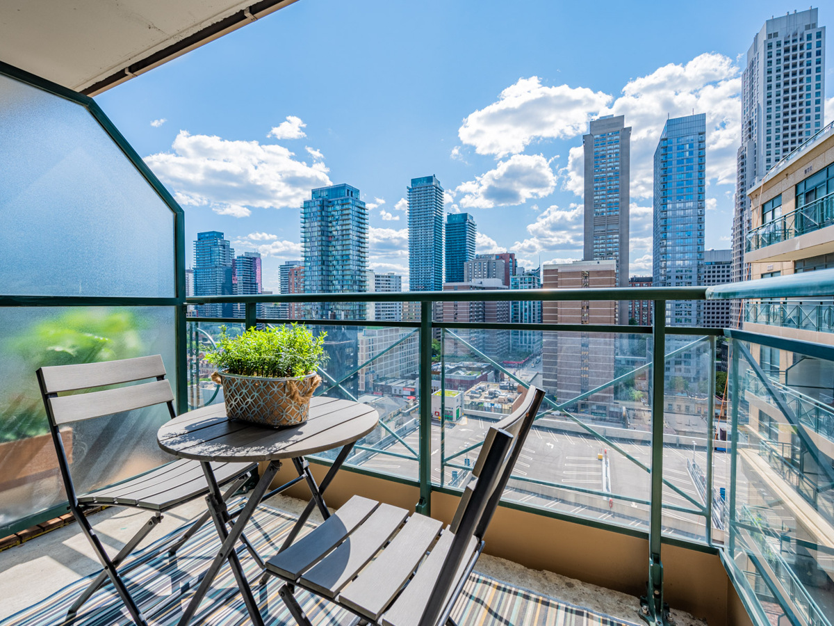 Condo balcony with glazed diver and glass panels.