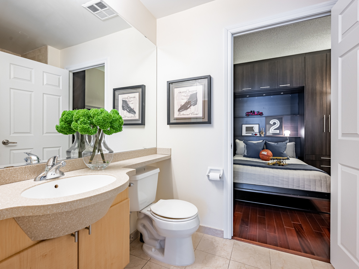 View of condo den through bathroom.