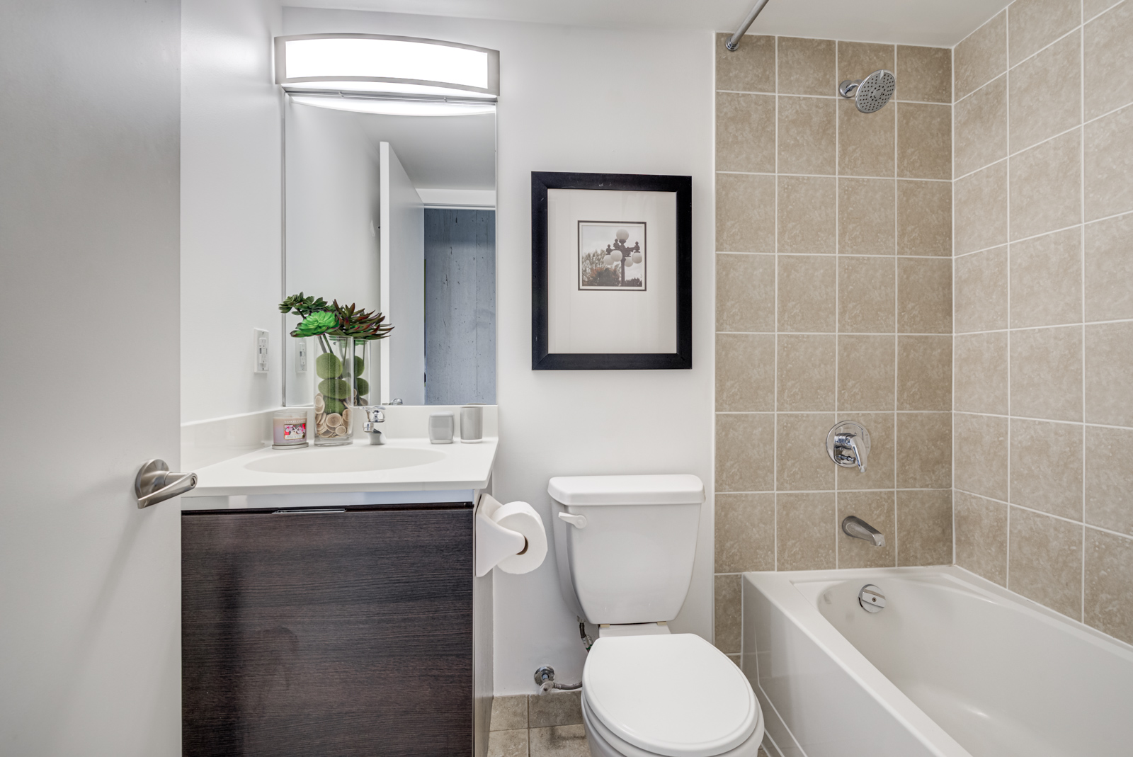 Washroom with shower, tub and large vanity.