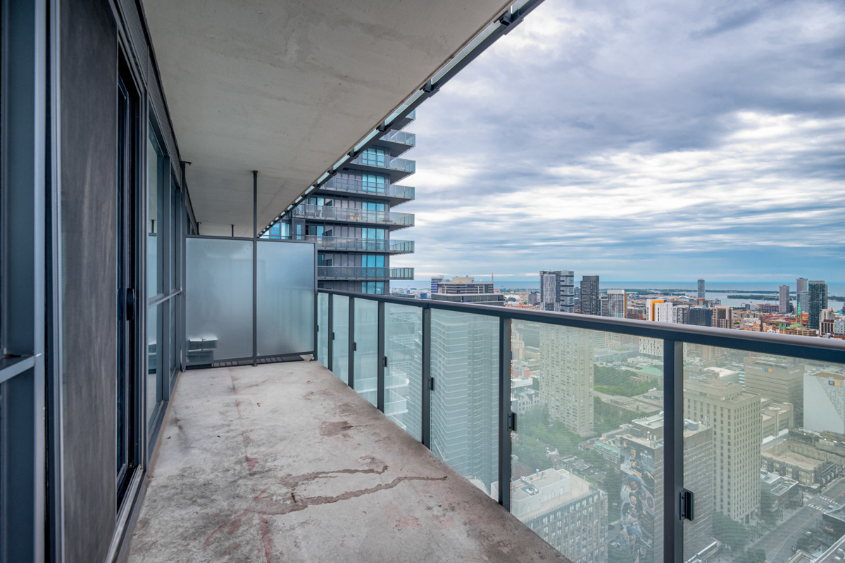 Balcony with glazed dividers and glass panels.