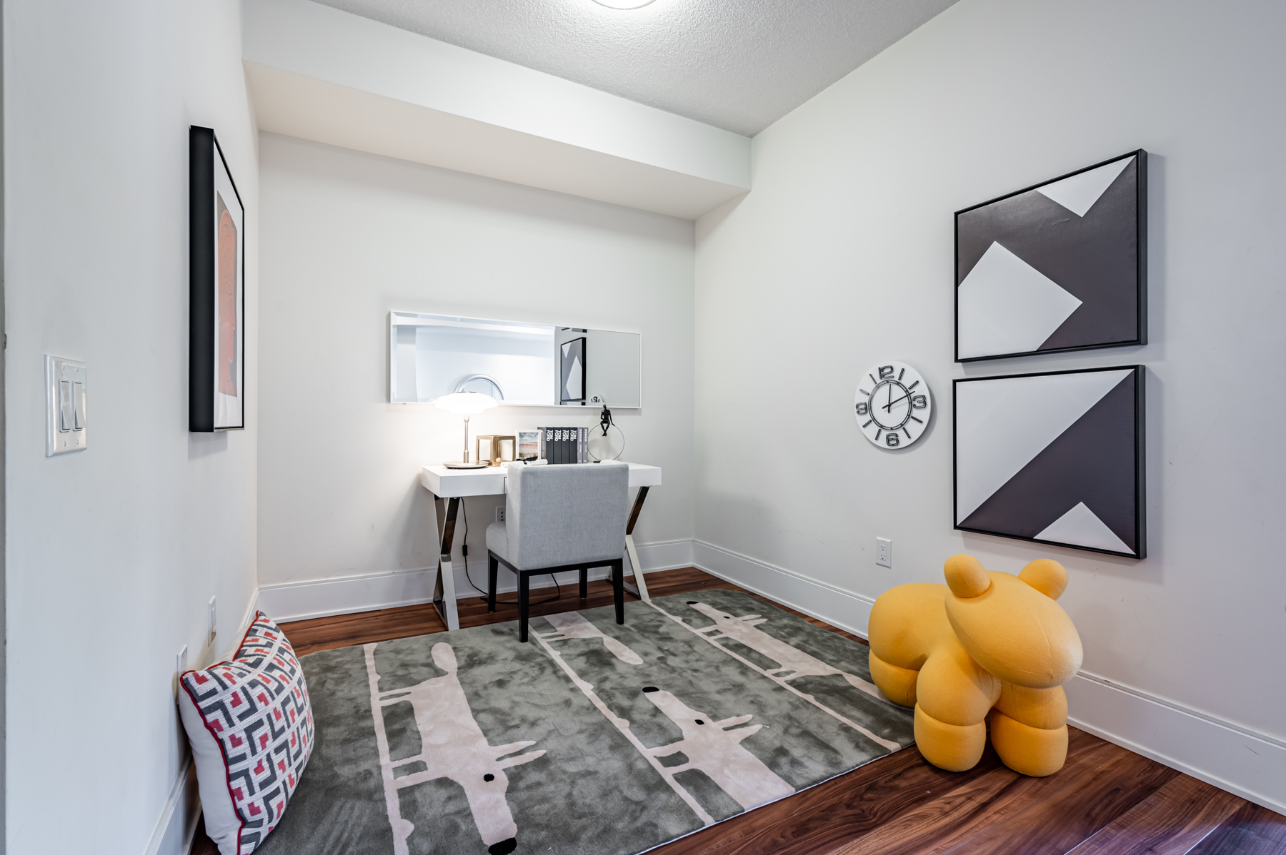 Den being used as a home office with desk, computer and chair.