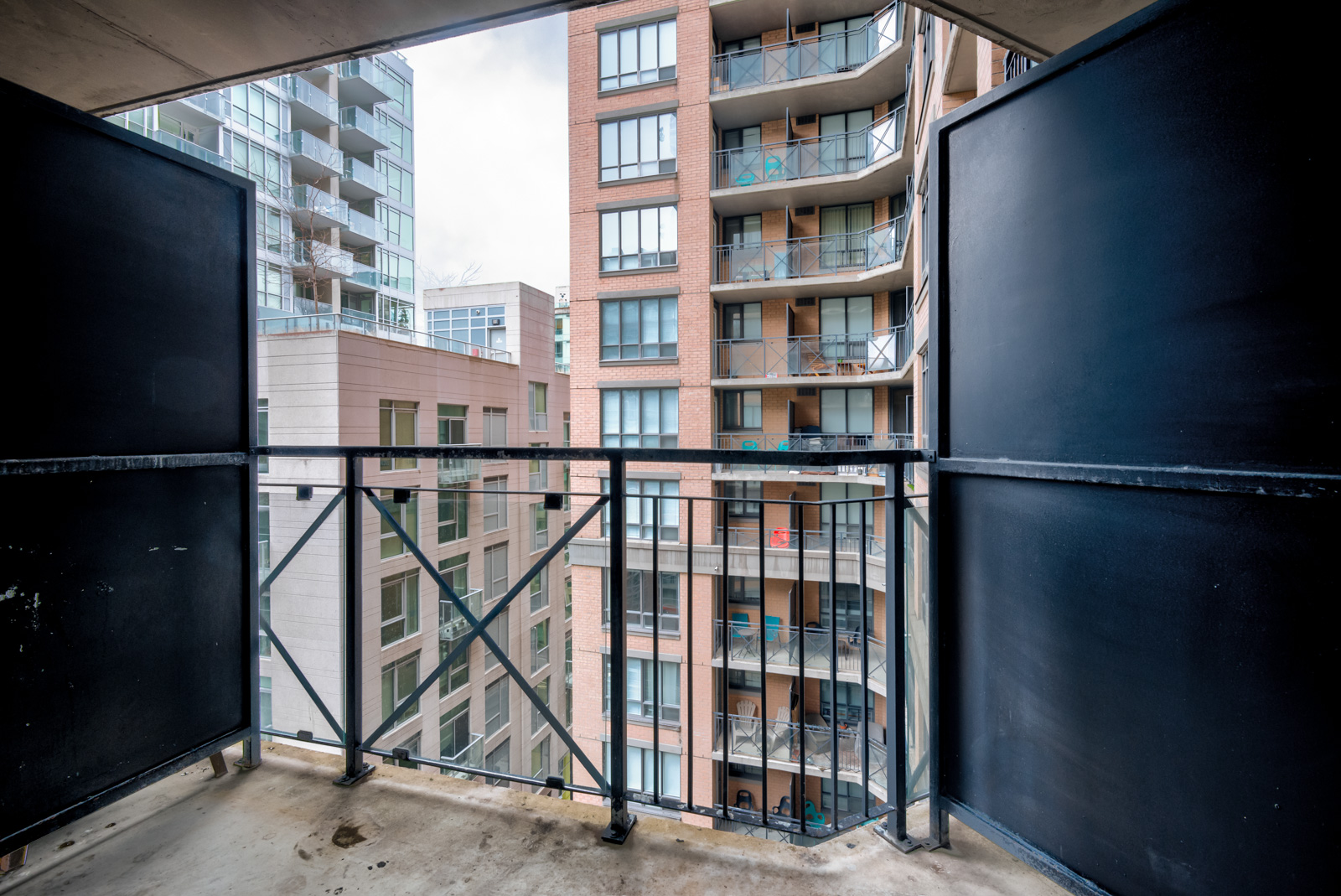 2 black dividers plus iron railing of balcony.